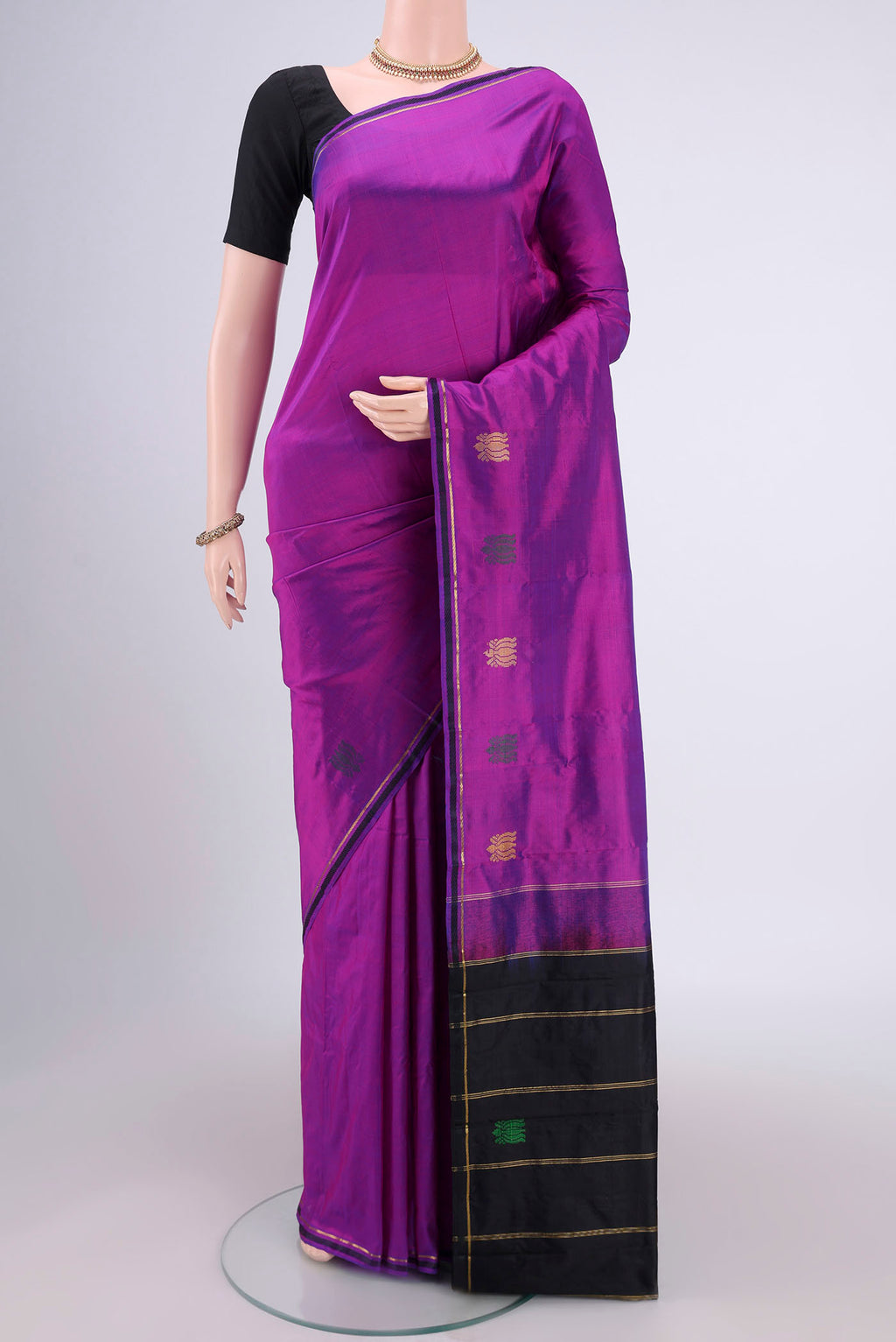 Purple Dual Tone Kanchipuram Silk Saree with Plain Body and Zari And Thread Border.  displayed on a mannequin