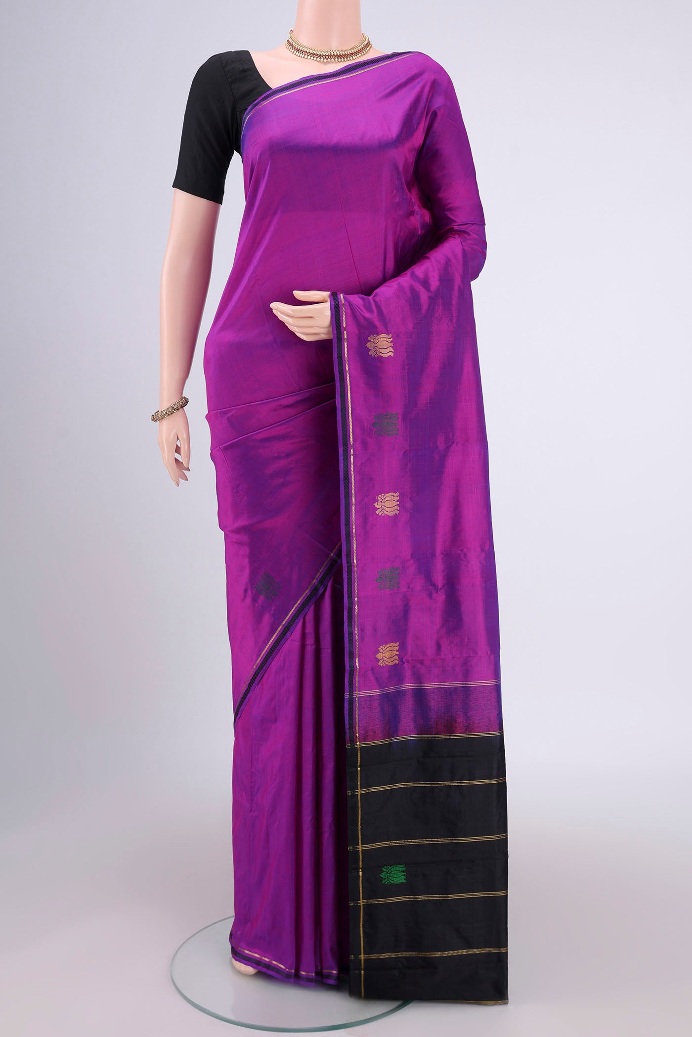 Purple Dual Tone Kanchipuram Silk Saree with Plain Body and Zari And Thread Border.  displayed on a mannequin