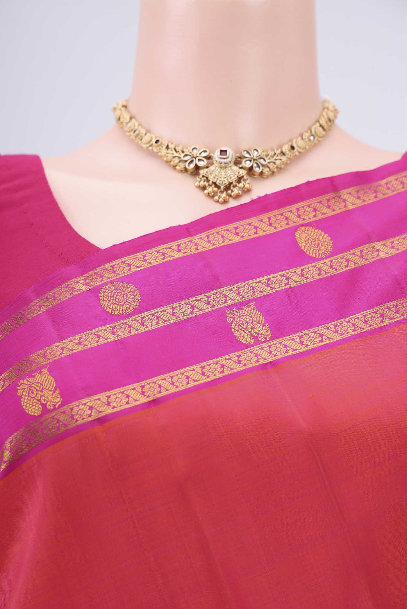 Border image of Orange Dual Tone Kanchipuram Silk Saree with Plain Body and Attached Border. 