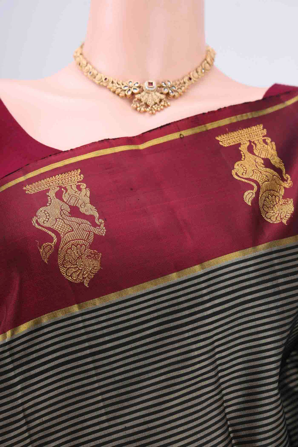 Border image of Black Kanchipuram Silk Saree with Stripes on the body and Attached Border. 