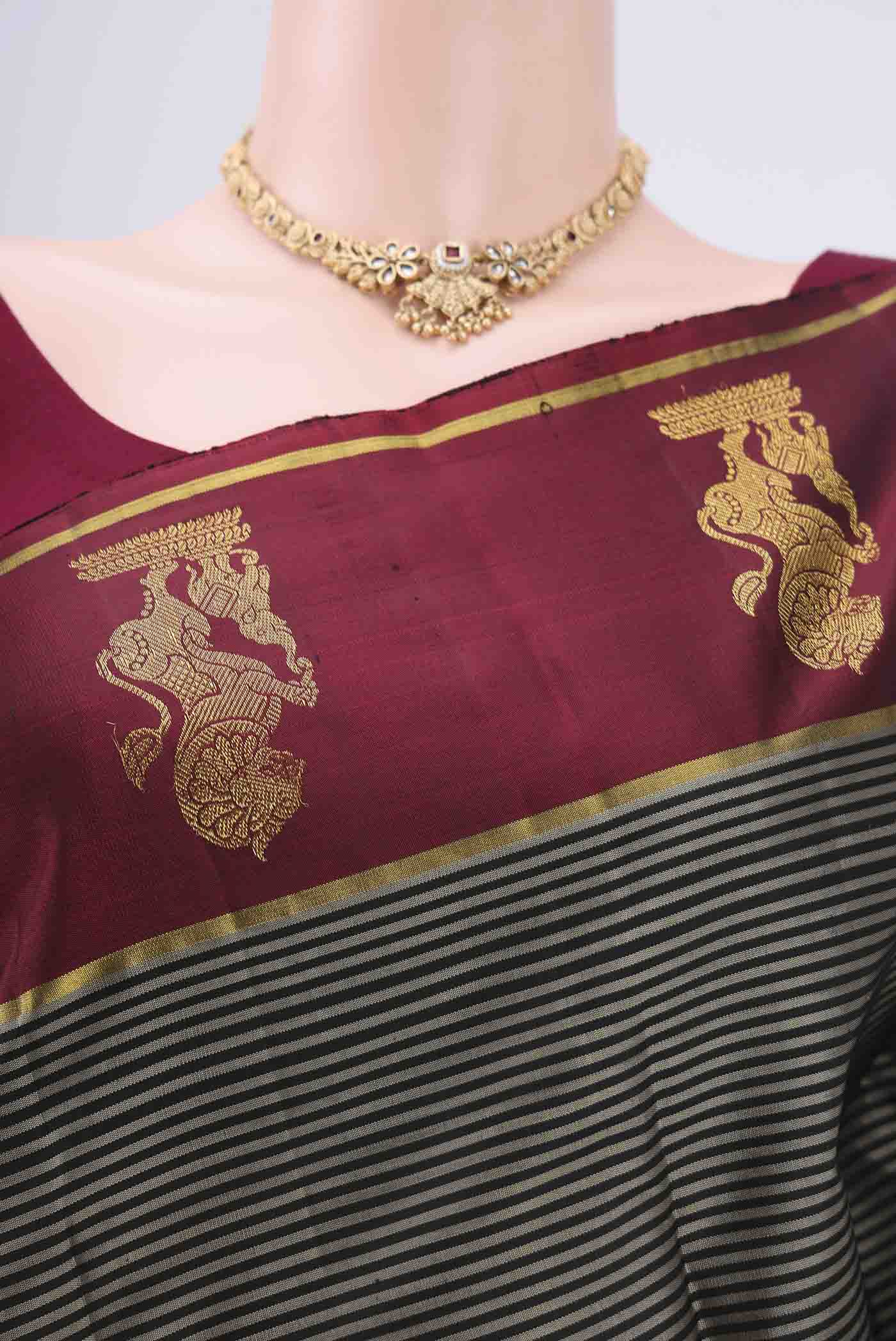 Border image of Black Kanchipuram Silk Saree with Stripes on the body and Attached Border. 