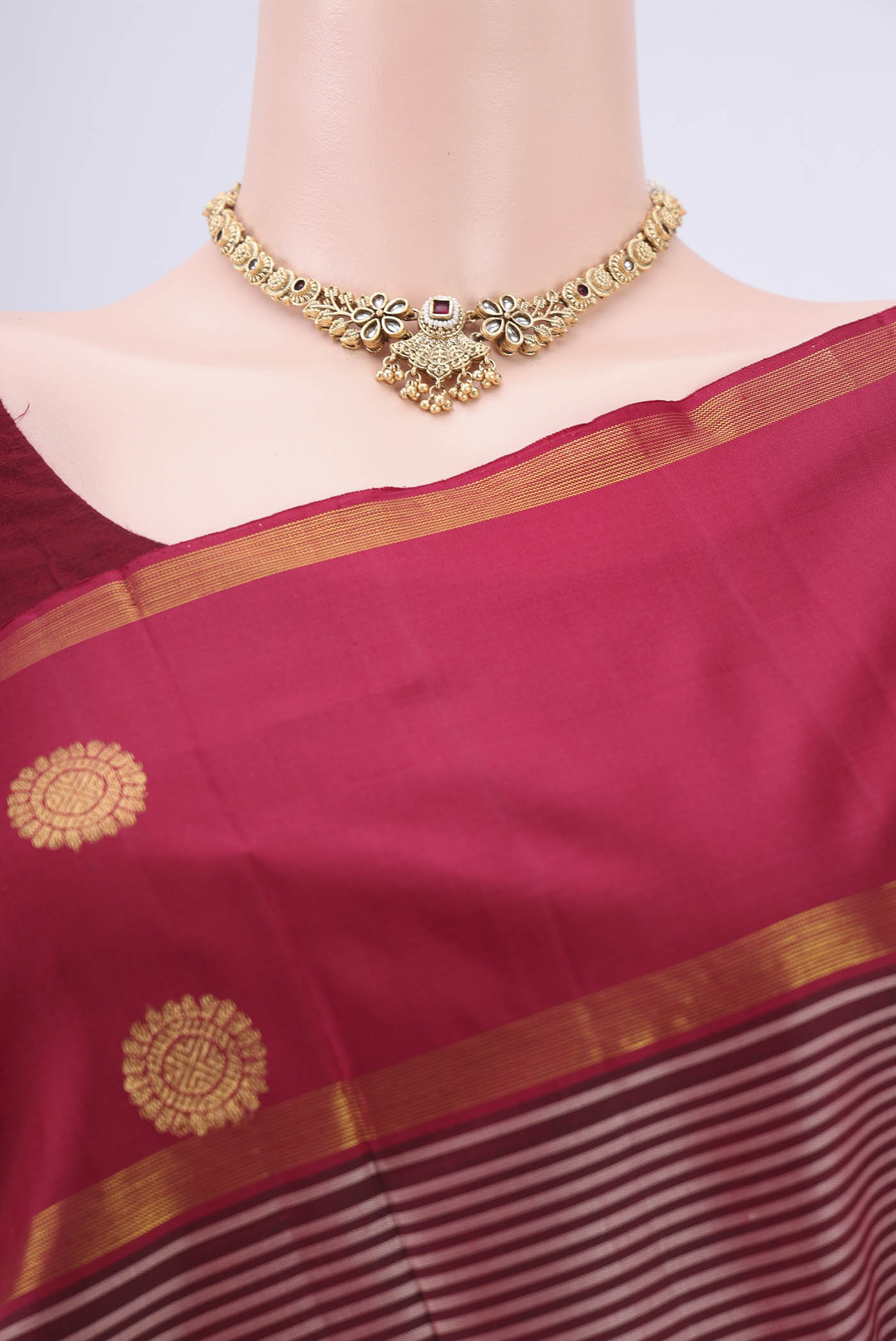 Border image of Maroon Dual Tone Kanchipuram Silk Saree with Stripes on the body and Attached Border. 