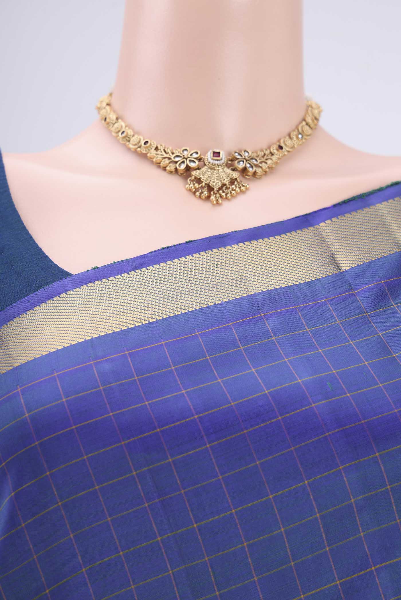 Border image of Blue Dual Tone Kanjivaram Silk Saree with Checked design on the body and Zari Border. 