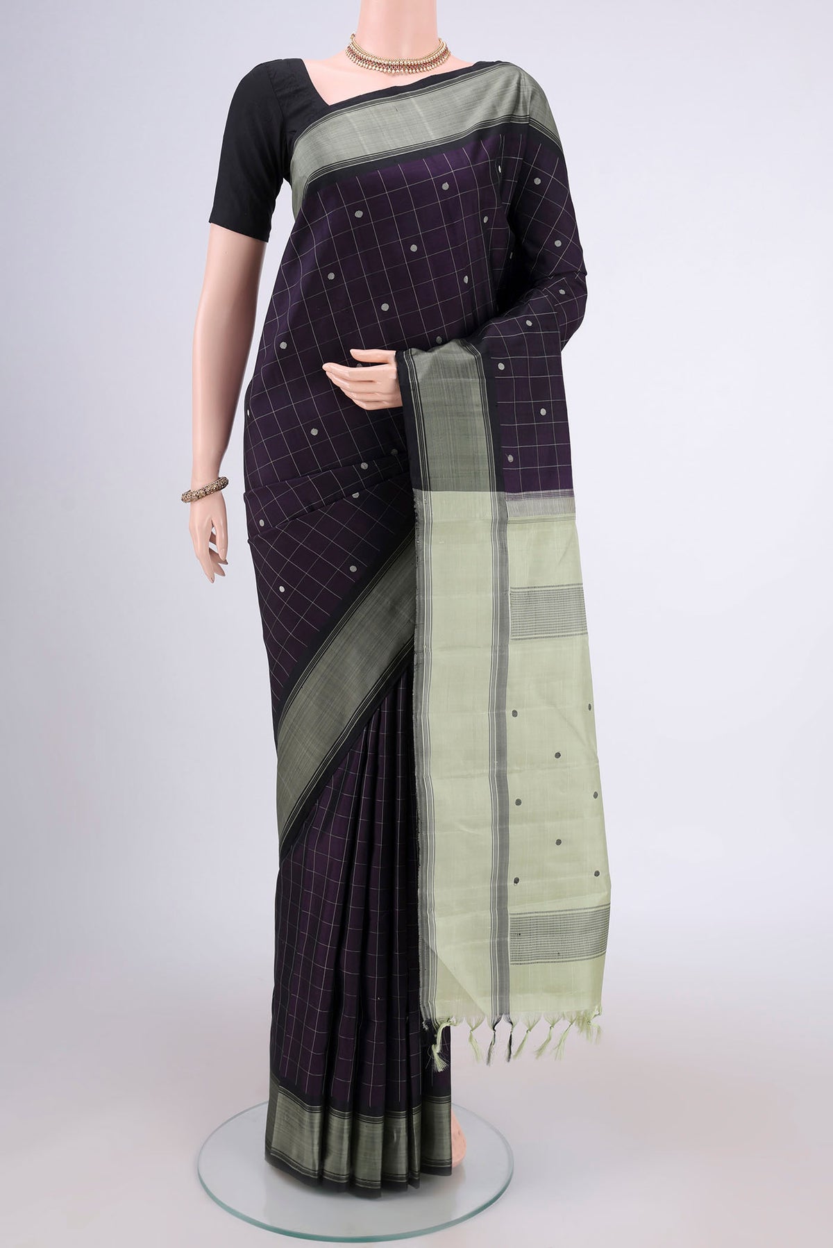 Purple Dual Tone Kanjivaram Silk Saree with Checked design on the body and Thread Border.  displayed on a mannequin