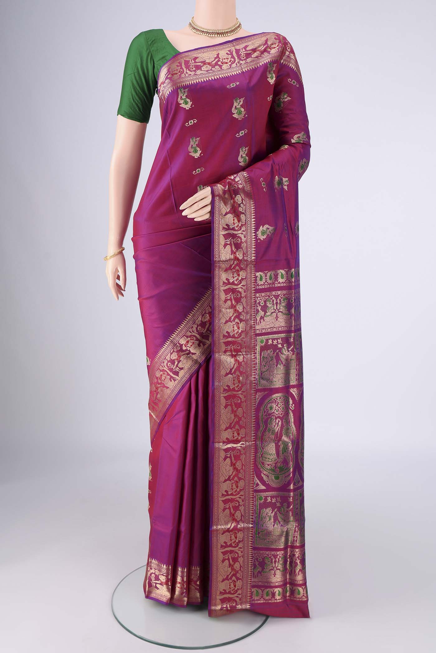 Magenta Baluchari Silk Saree with Zari And Thread Butta on the body and Zari And Thread Border.  displayed on a mannequin