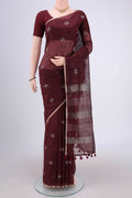 Maroon Blended Linen Saree with Thread Butta on the body and Zari Border.  displayed on a mannequin