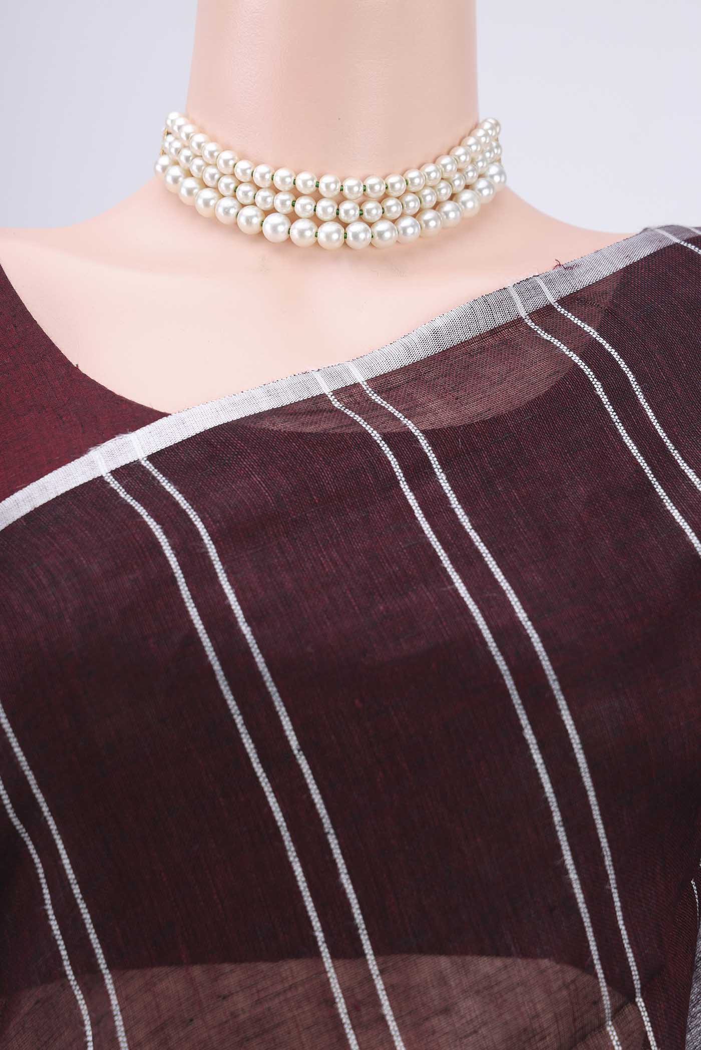 Border image of Brown Blended Linen Saree with Stripes on the body and Zari Border. 