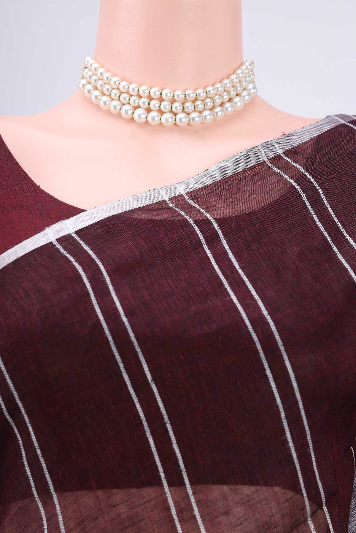 Border image of Brown Blended Linen Saree with Stripes on the body and Zari Border. 