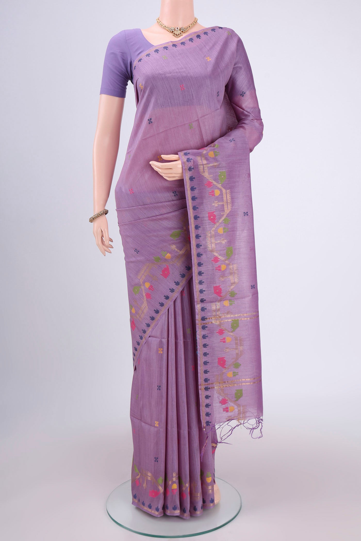 Mauve Tussar Silk Saree with Jamdani on the body and Zari Border.  displayed on a mannequin