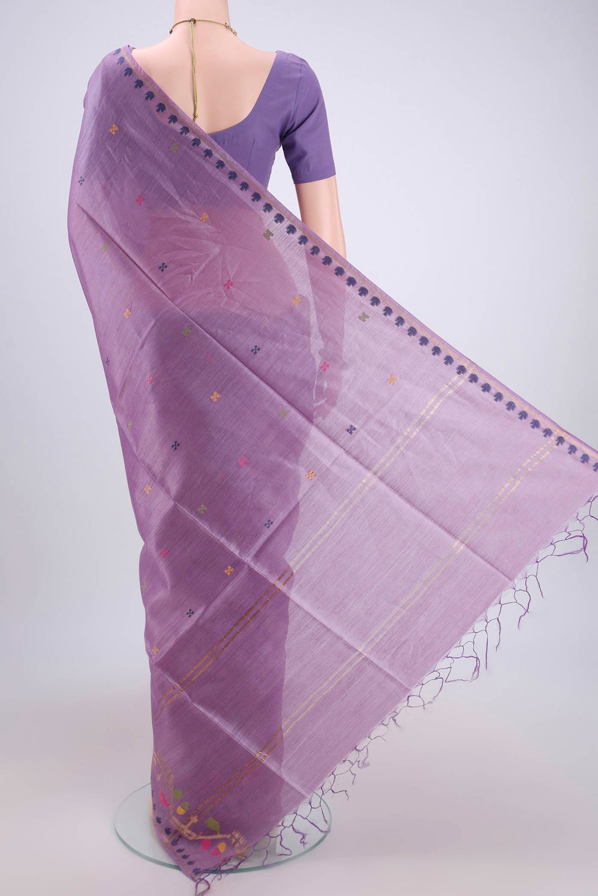 Flat view of Mauve Tussar Silk Saree with Jamdani on the body and Zari Border. 