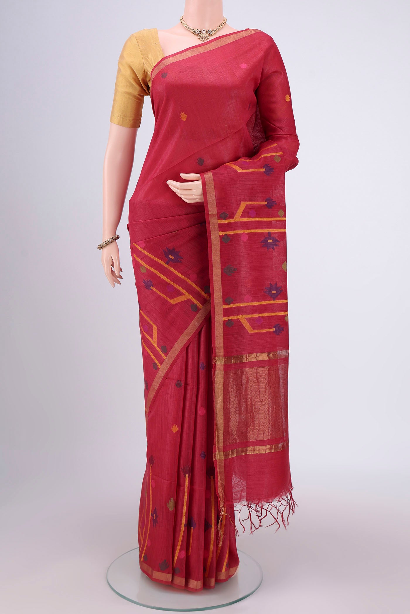 Red Tussar Silk Saree with Jamdani on the body and Zari Border.  displayed on a mannequin