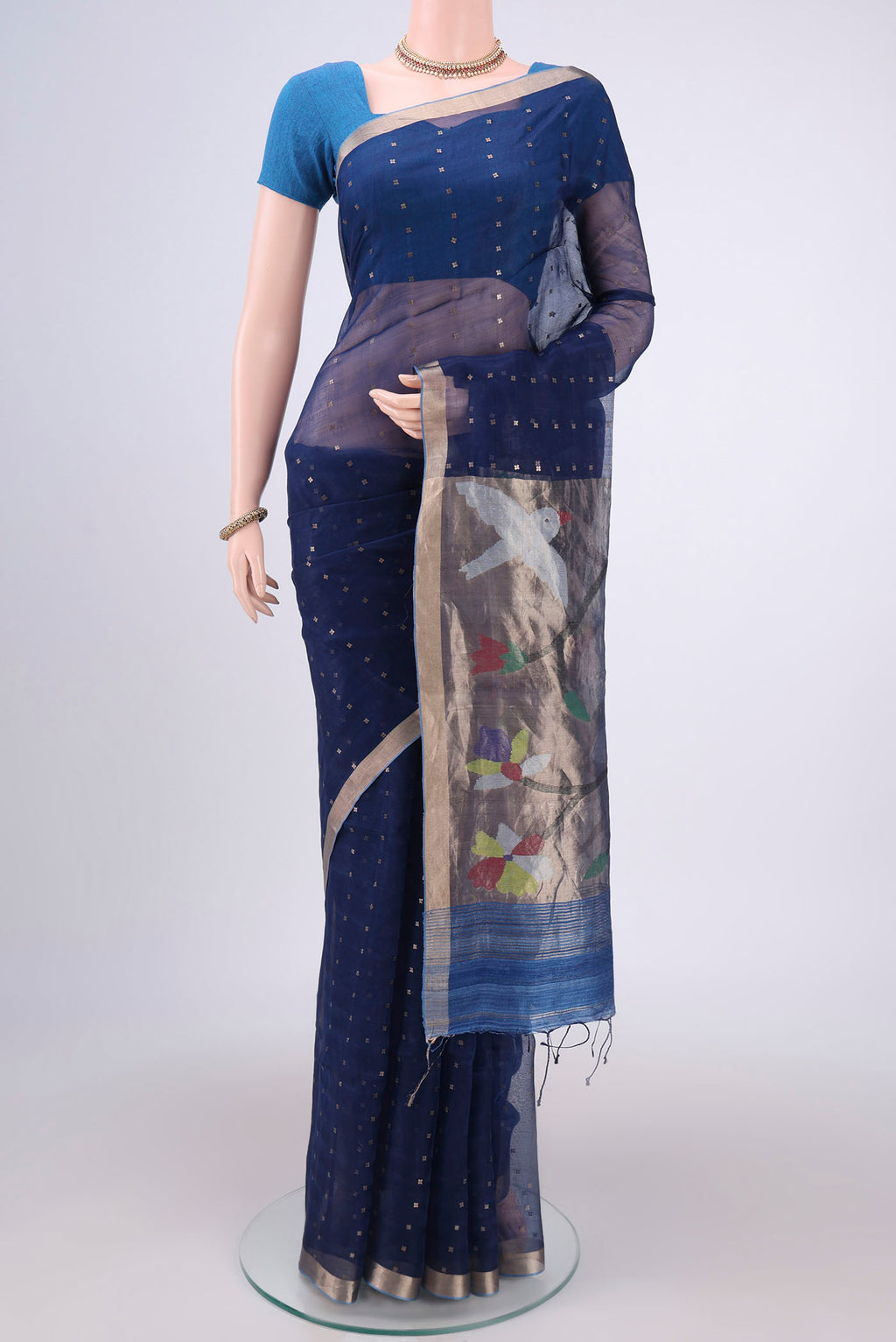 Navy Blue Kora Silk Saree with Fancy on the body and Zari Border.  displayed on a mannequin