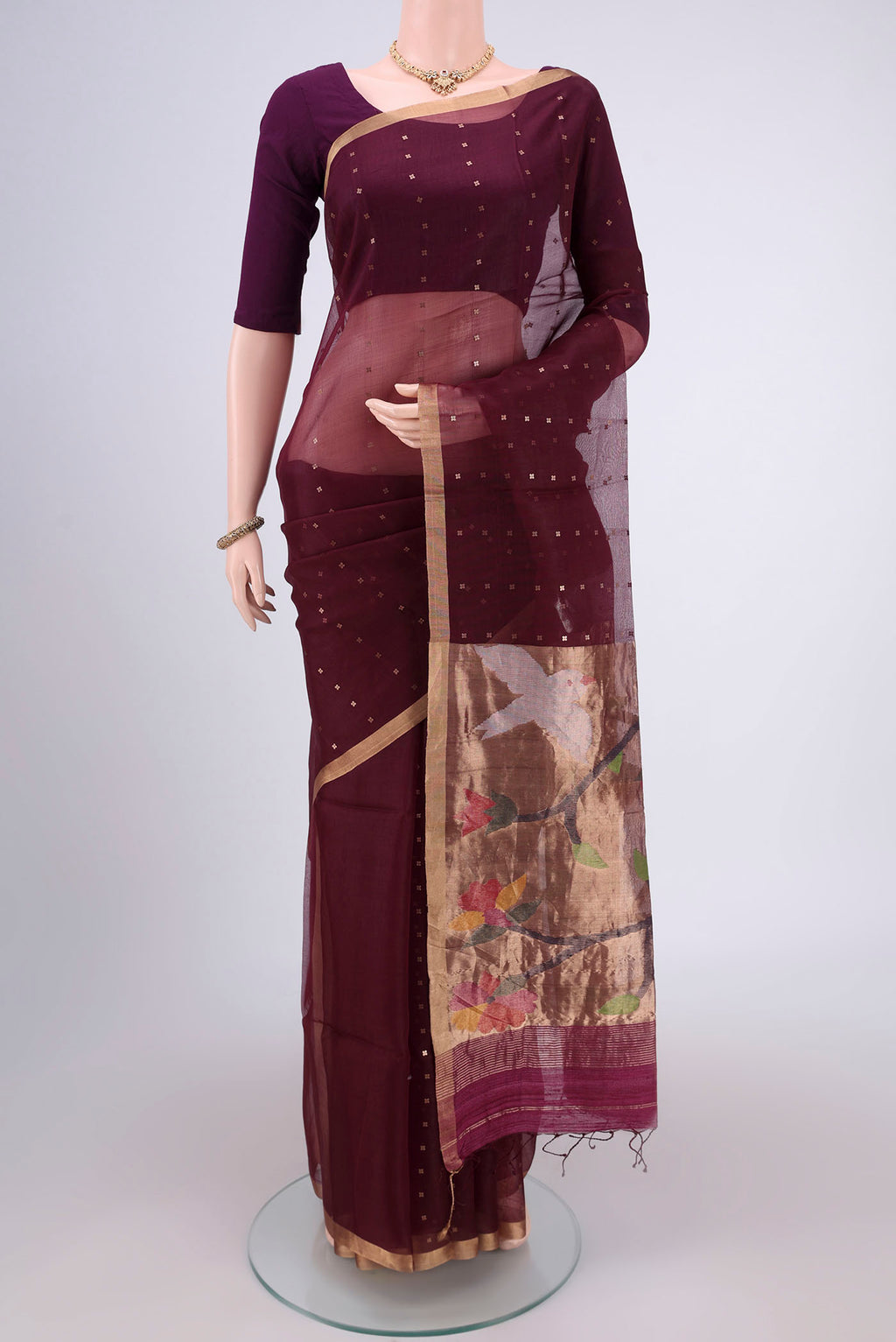 Maroon Kora Silk Saree with Fancy on the body and Zari Border.  displayed on a mannequin