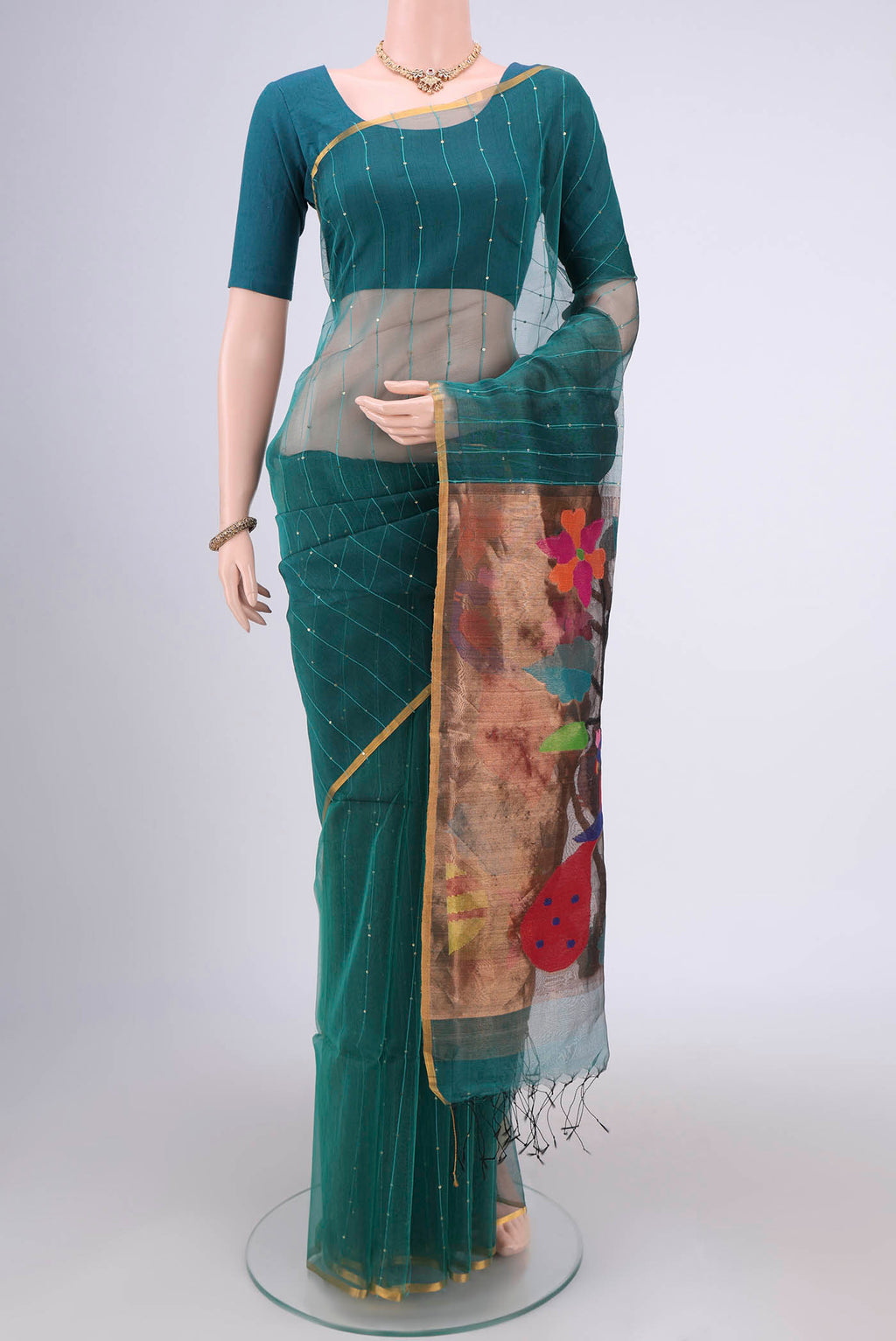 Sea Green Kora Silk Saree with Fancy on the body and Zari Border.  displayed on a mannequin