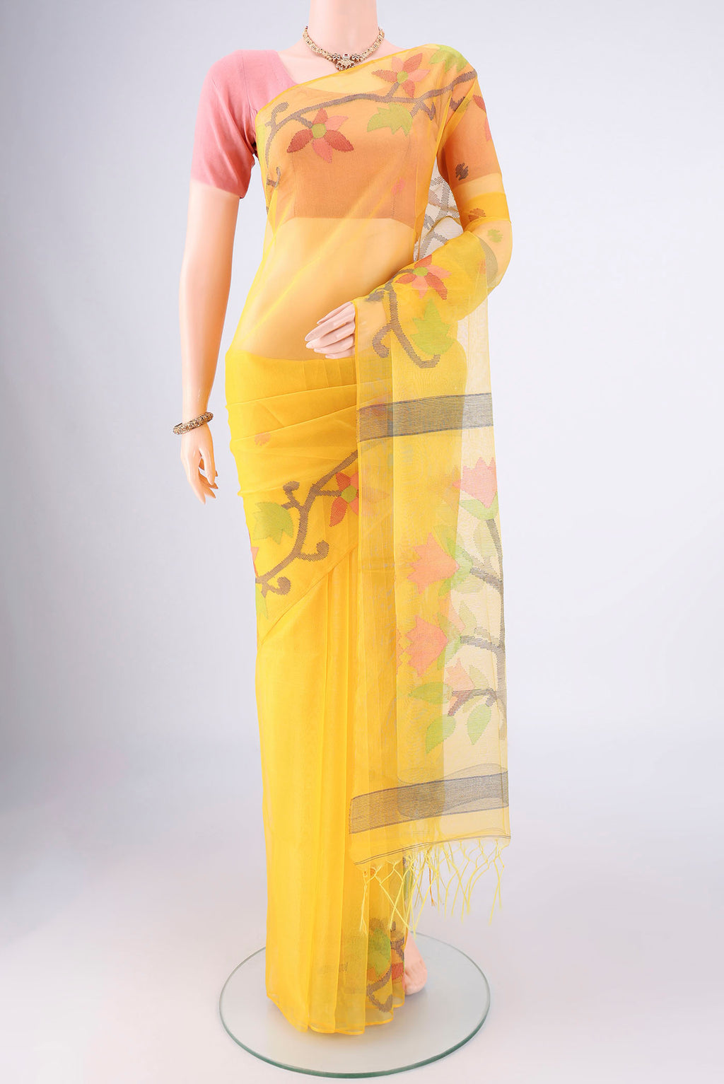 Yellow Kora Silk Saree with Jamdani on the body and Plain Border.  displayed on a mannequin