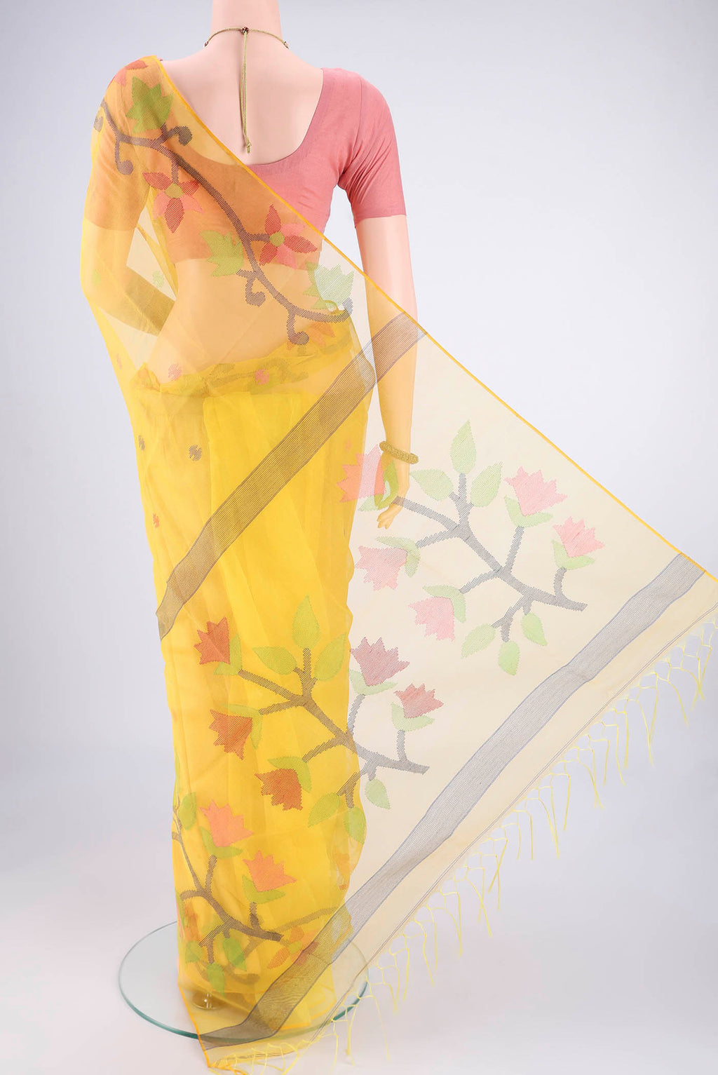 Flat view of Yellow Kora Silk Saree with Jamdani on the body and Plain Border. 