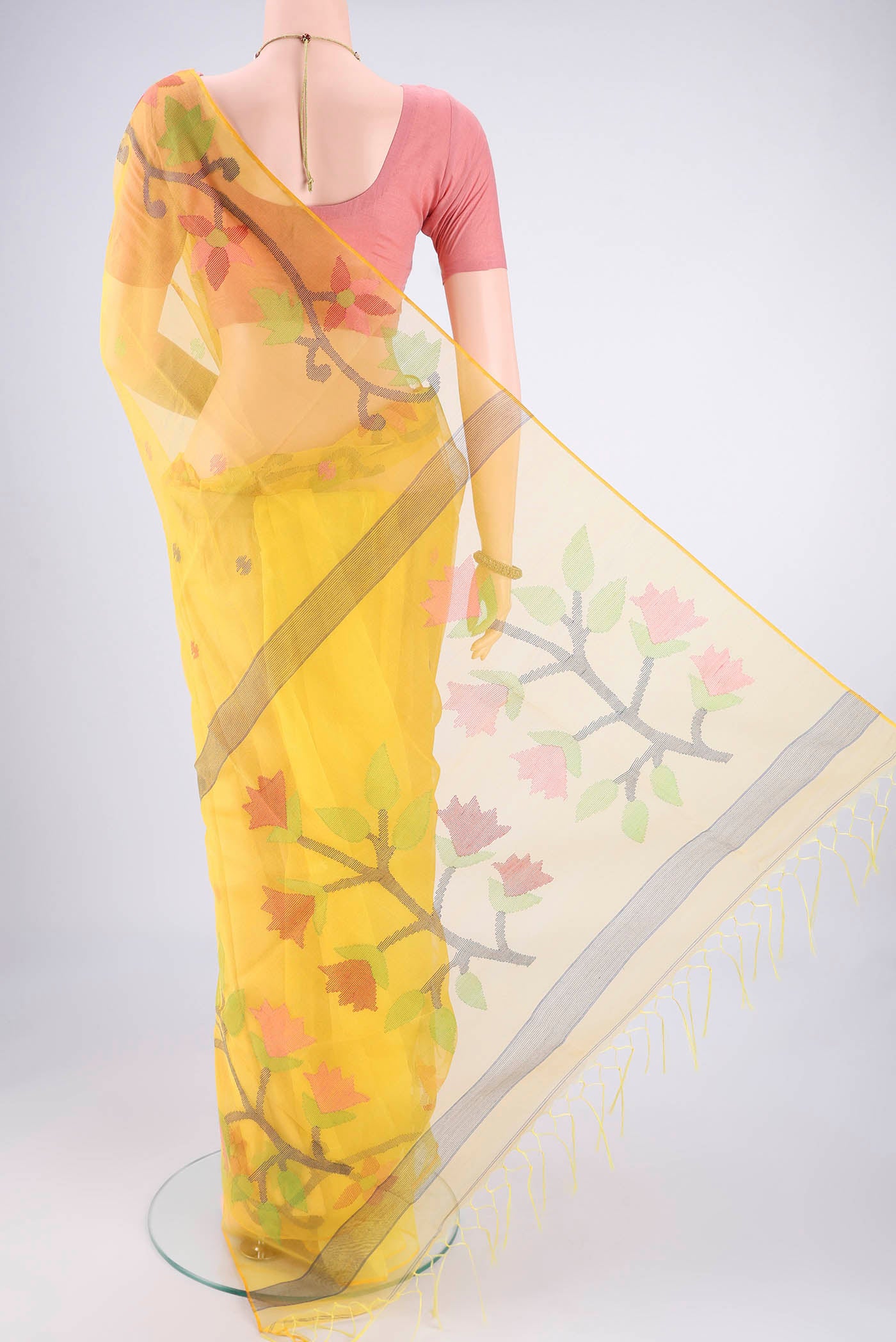 Flat view of Yellow Kora Silk Saree with Jamdani on the body and Plain Border. 