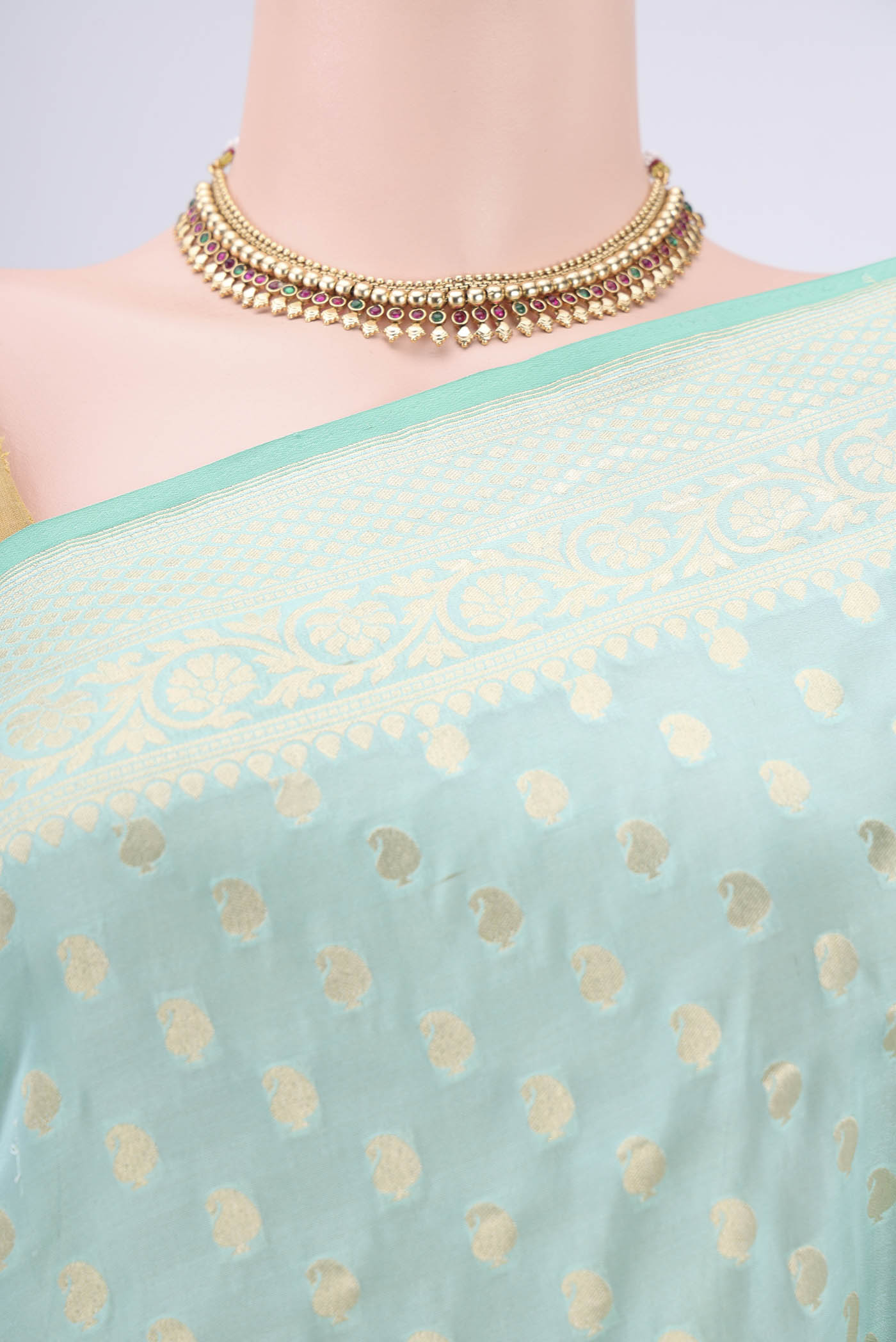 Border image of Mint Green Dual Tone Banarasi Silk Saree with Zari Butta on the body and Zari Border. 