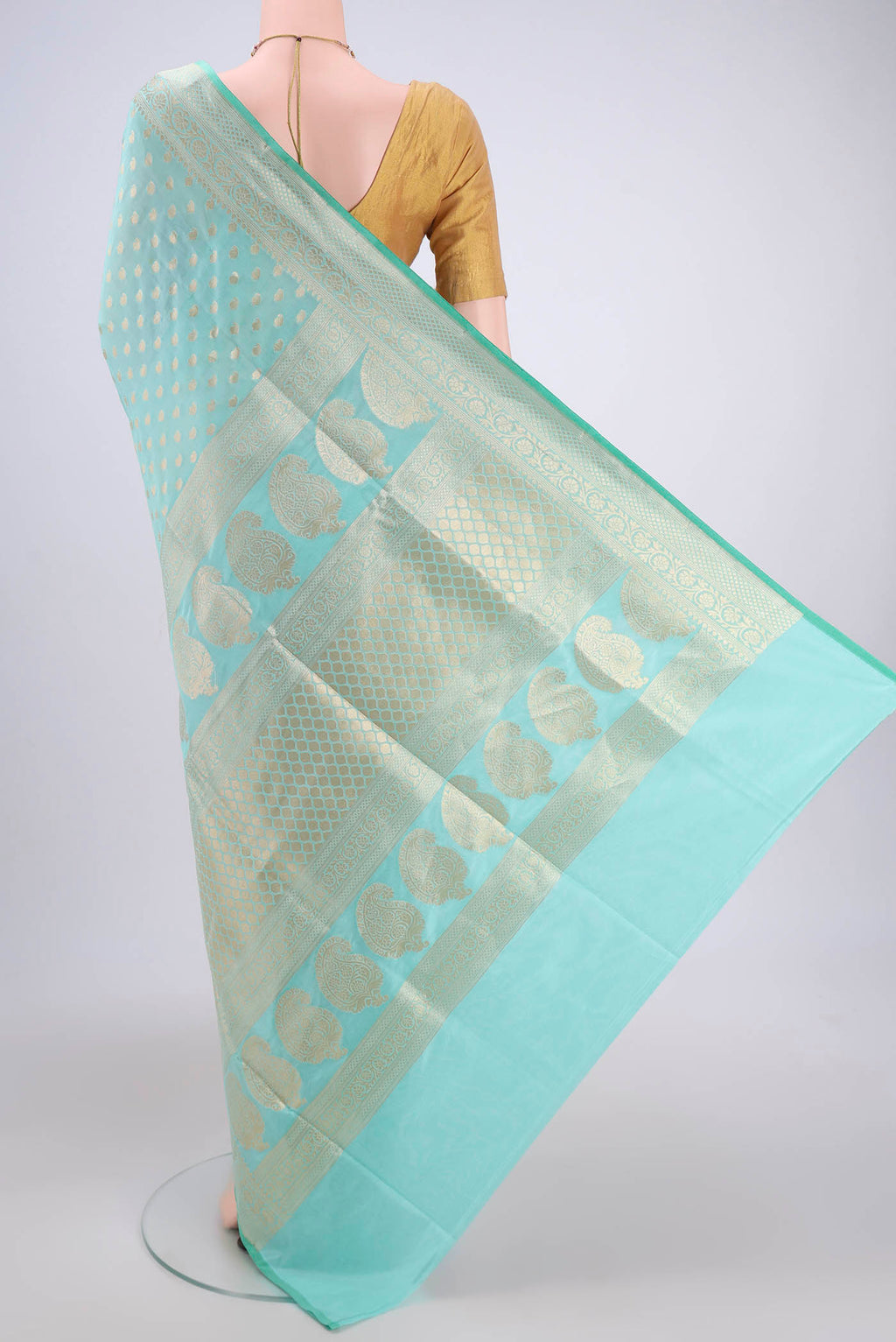 Flat view of Mint Green Dual Tone Banarasi Silk Saree with Zari Butta on the body and Zari Border. 