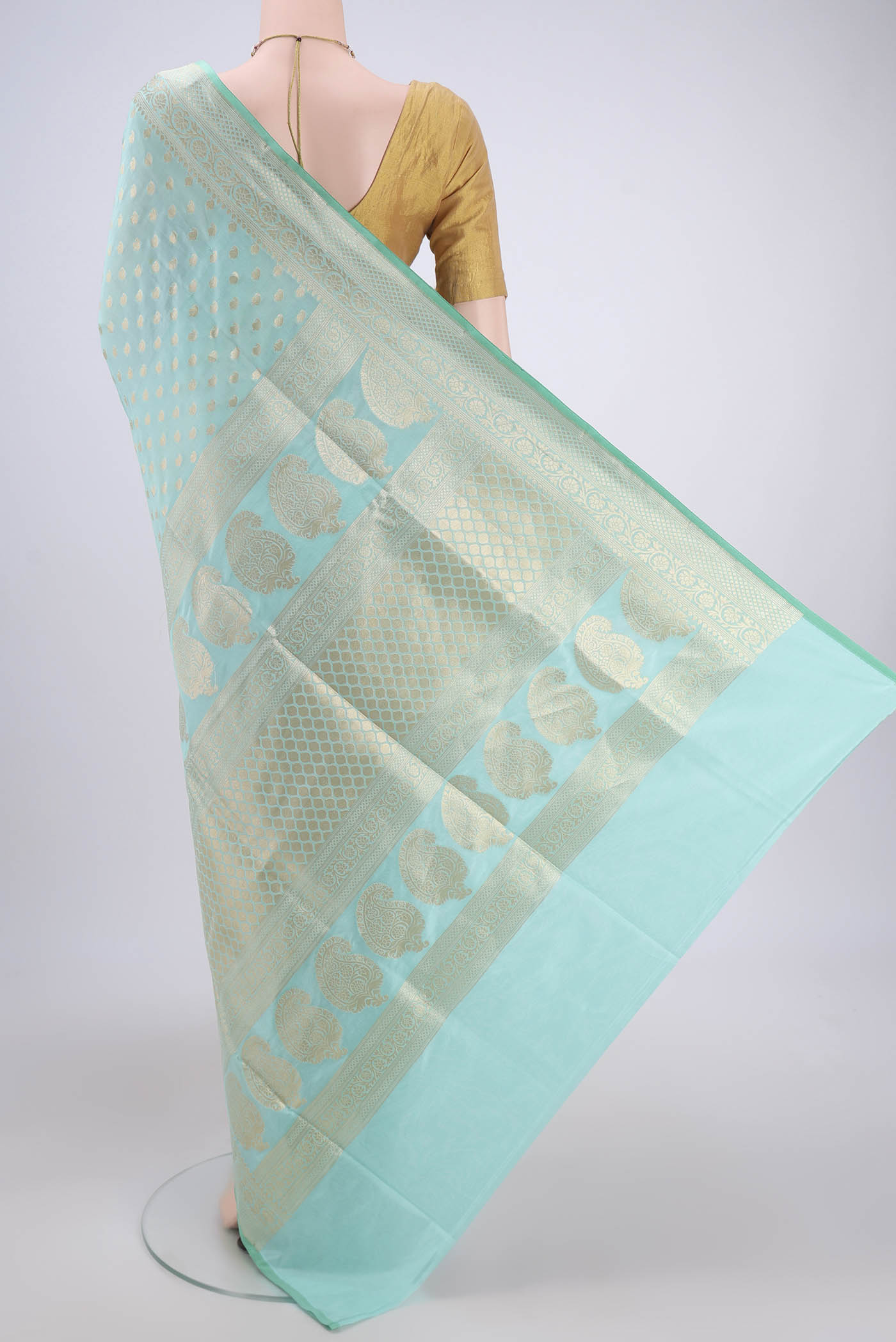 Flat view of Mint Green Dual Tone Banarasi Silk Saree with Zari Butta on the body and Zari Border. 