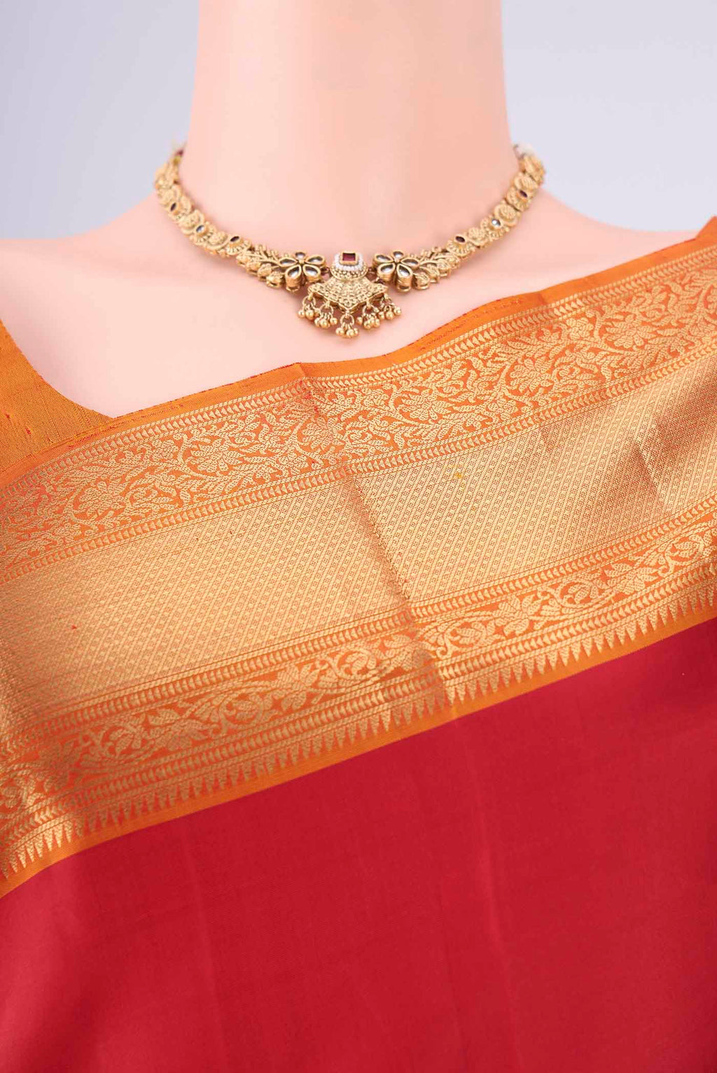 Border image of Maroon Soft Silk Saree with Zari Butta on the body and Zari Border. 