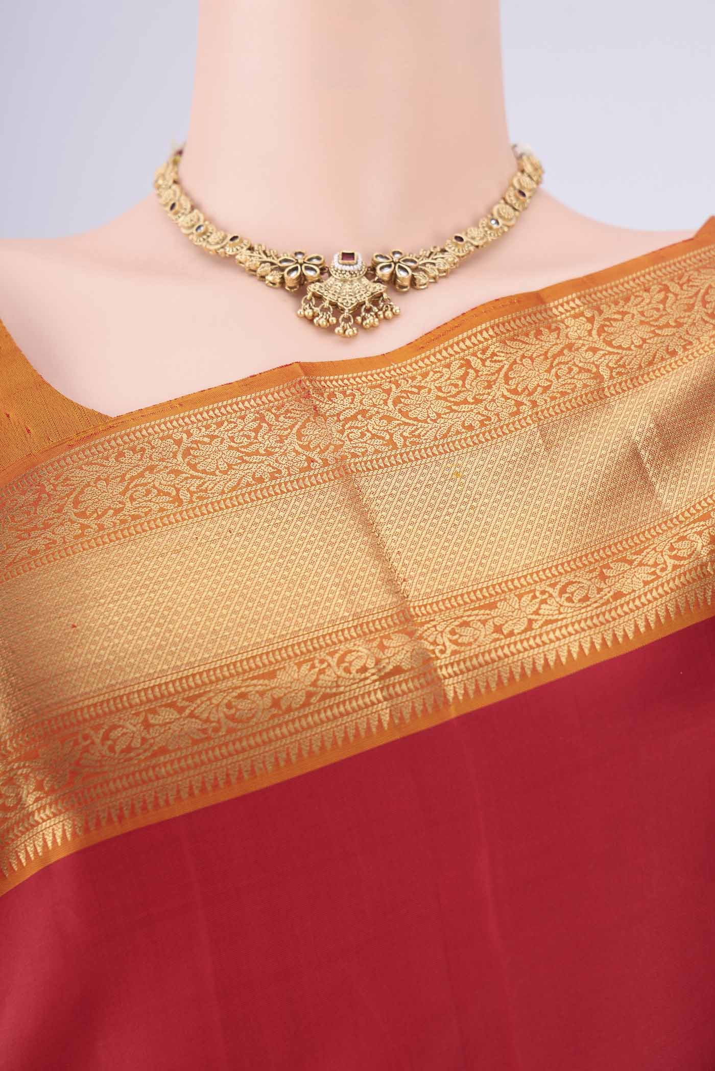 Border image of Maroon Soft Silk Saree with Zari Butta on the body and Zari Border. 