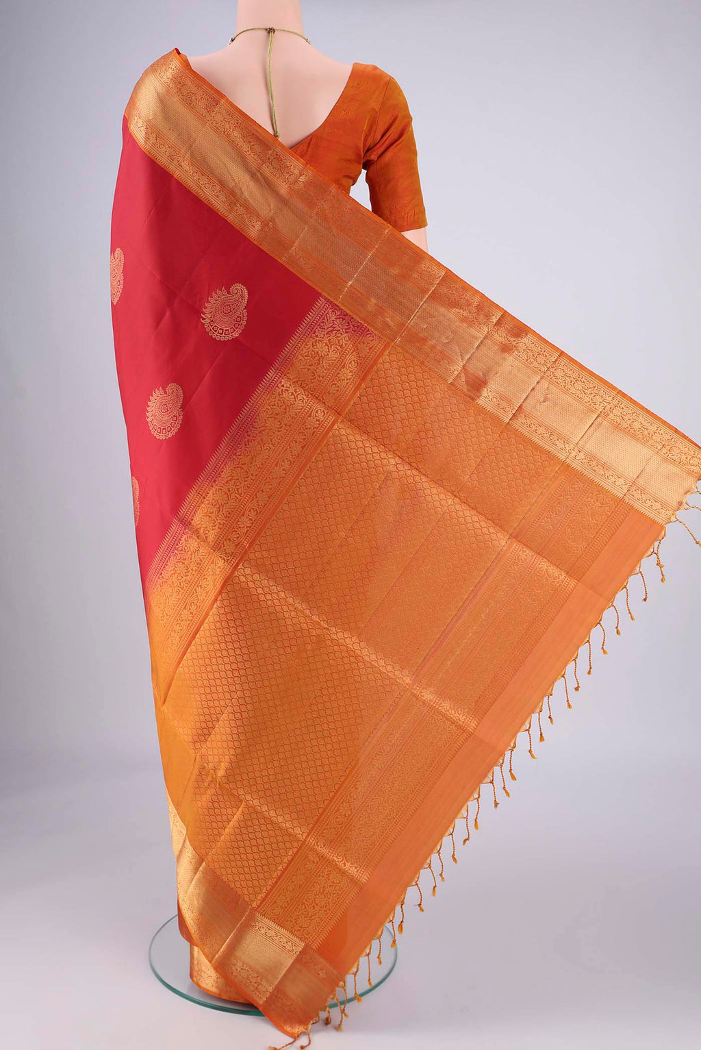 Flat view of Maroon Soft Silk Saree with Zari Butta on the body and Zari Border. 