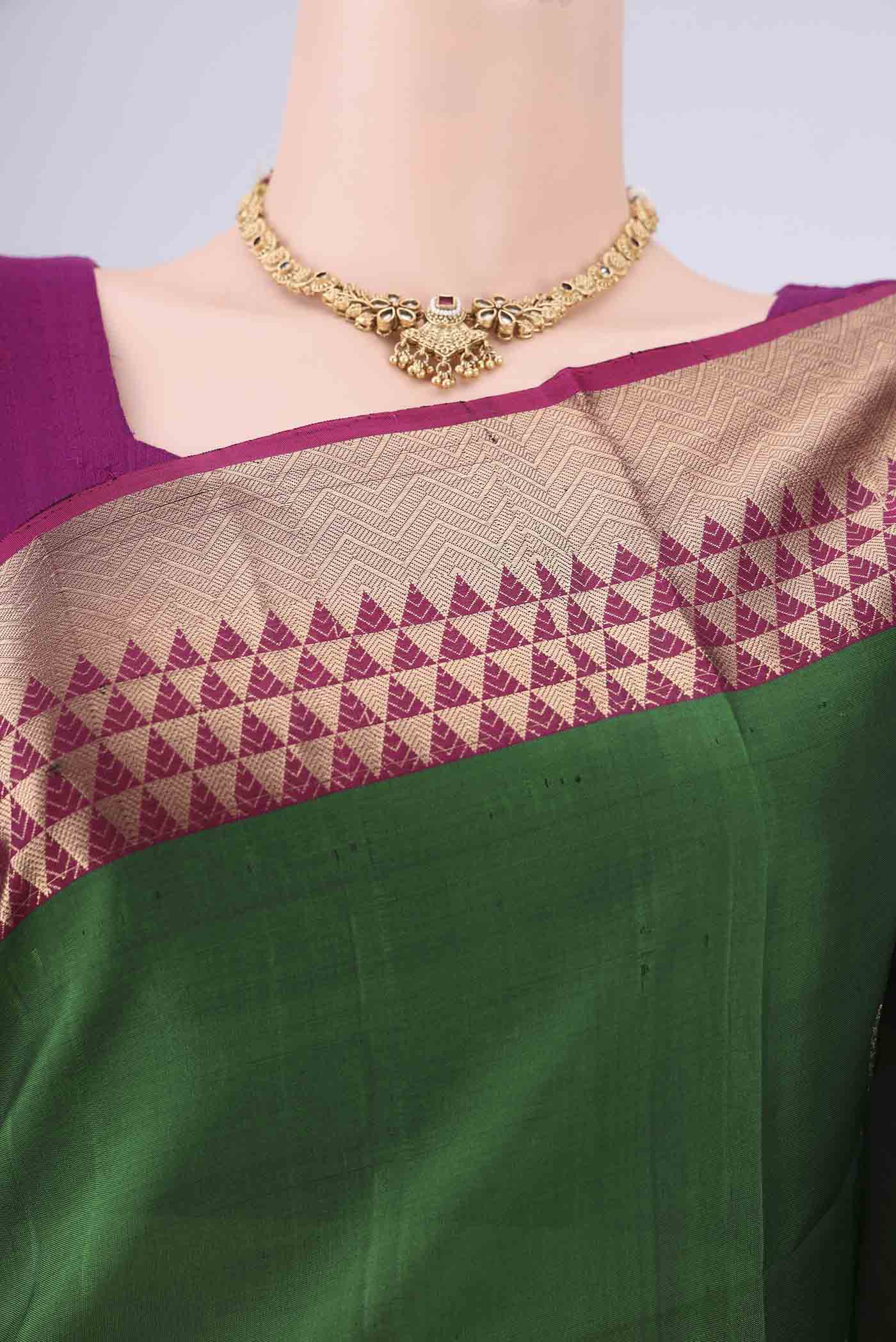 Border image of Bottle Green Soft Silk Saree with Zari Butta on the body and Zari Border. 