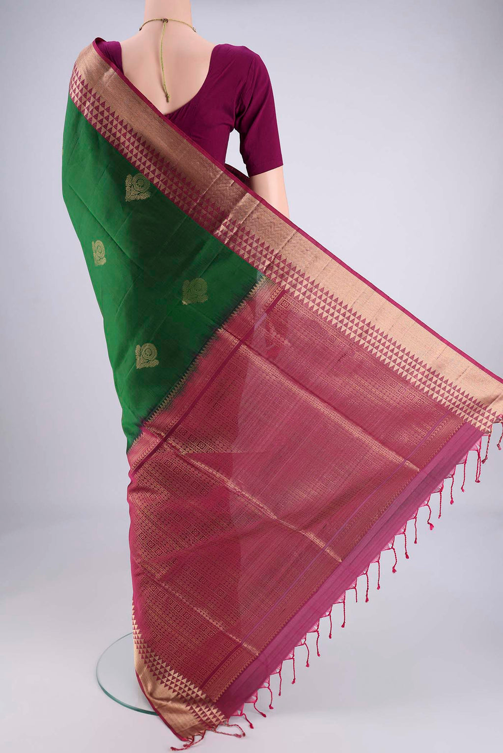 Flat view of Bottle Green Soft Silk Saree with Zari Butta on the body and Zari Border. 