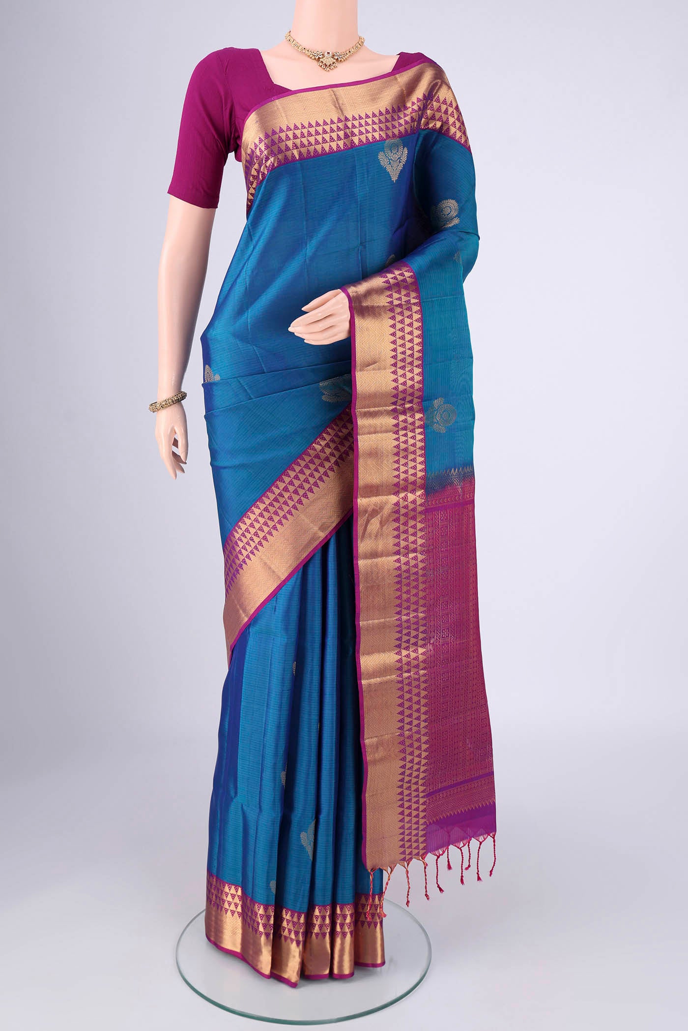 Blue Soft Silk Saree with Zari Butta on the body and Zari Border.  displayed on a mannequin