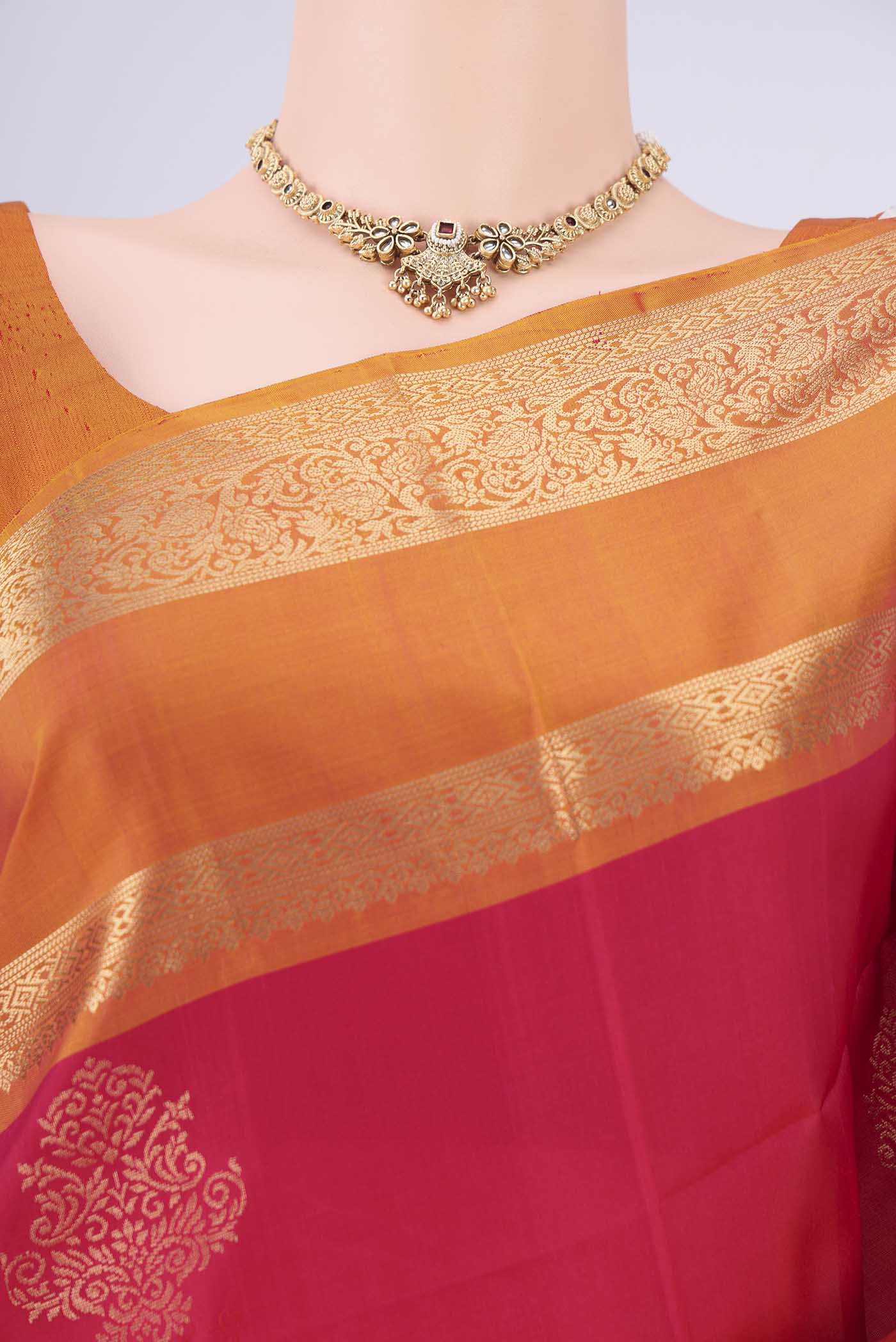 Border image of Rani Pink Soft Silk Saree with Zari Butta on the body and Zari Border. 