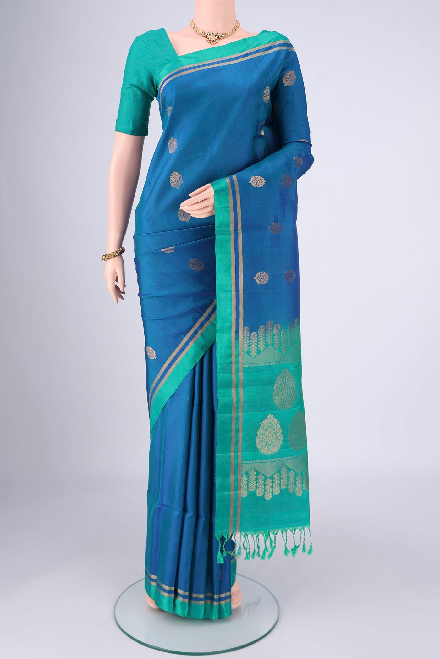 Blue Soft Silk Saree with Zig Zag design on the body and Zari Border.  displayed on a mannequin