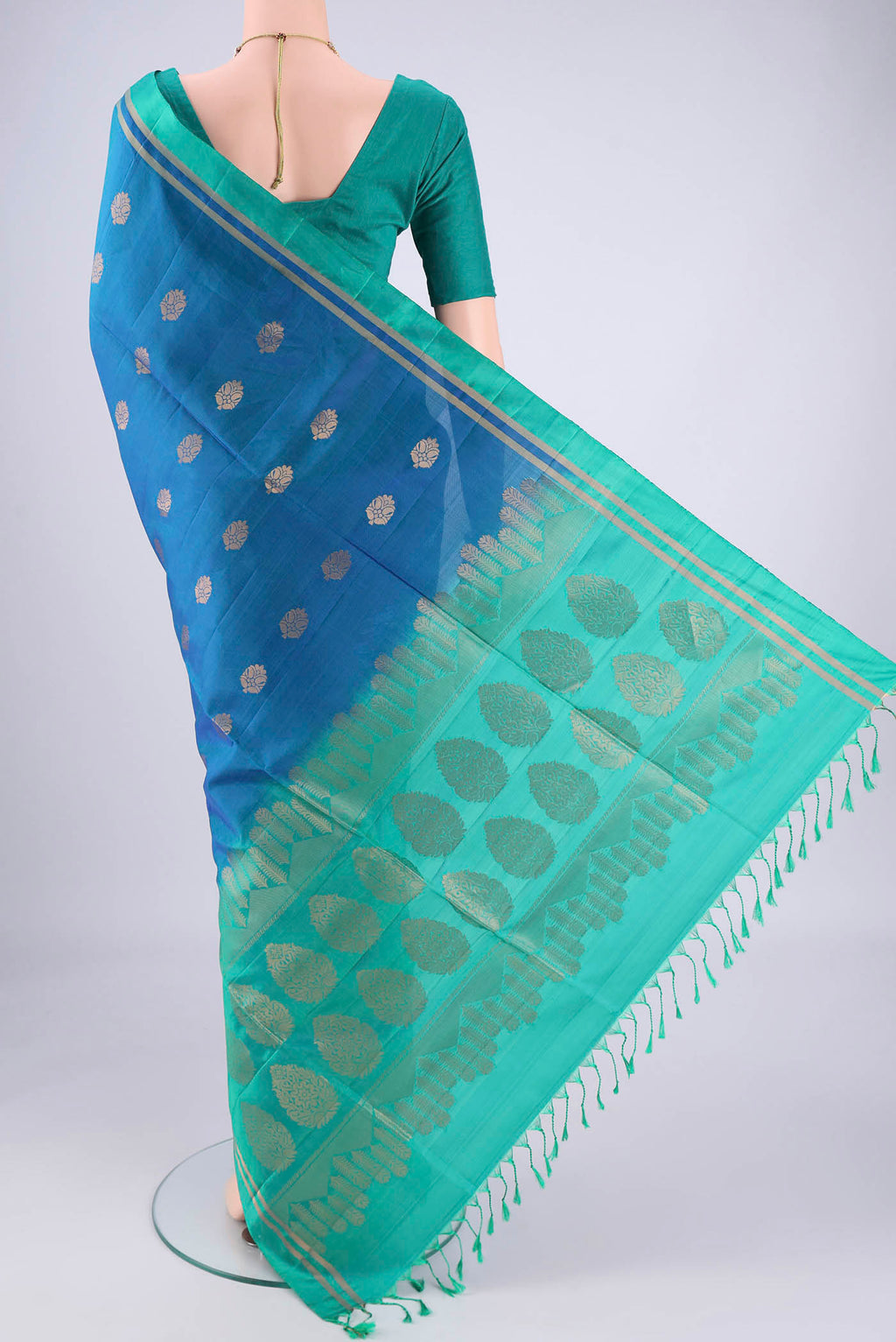 Flat view of Blue Soft Silk Saree with Zig Zag design on the body and Zari Border. 