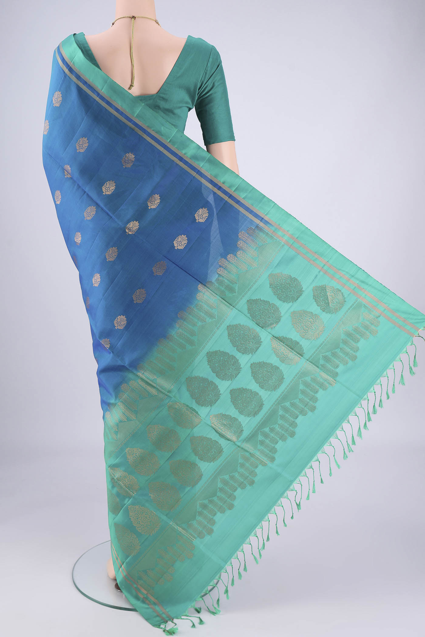 Flat view of Blue Soft Silk Saree with Zig Zag design on the body and Zari Border. 
