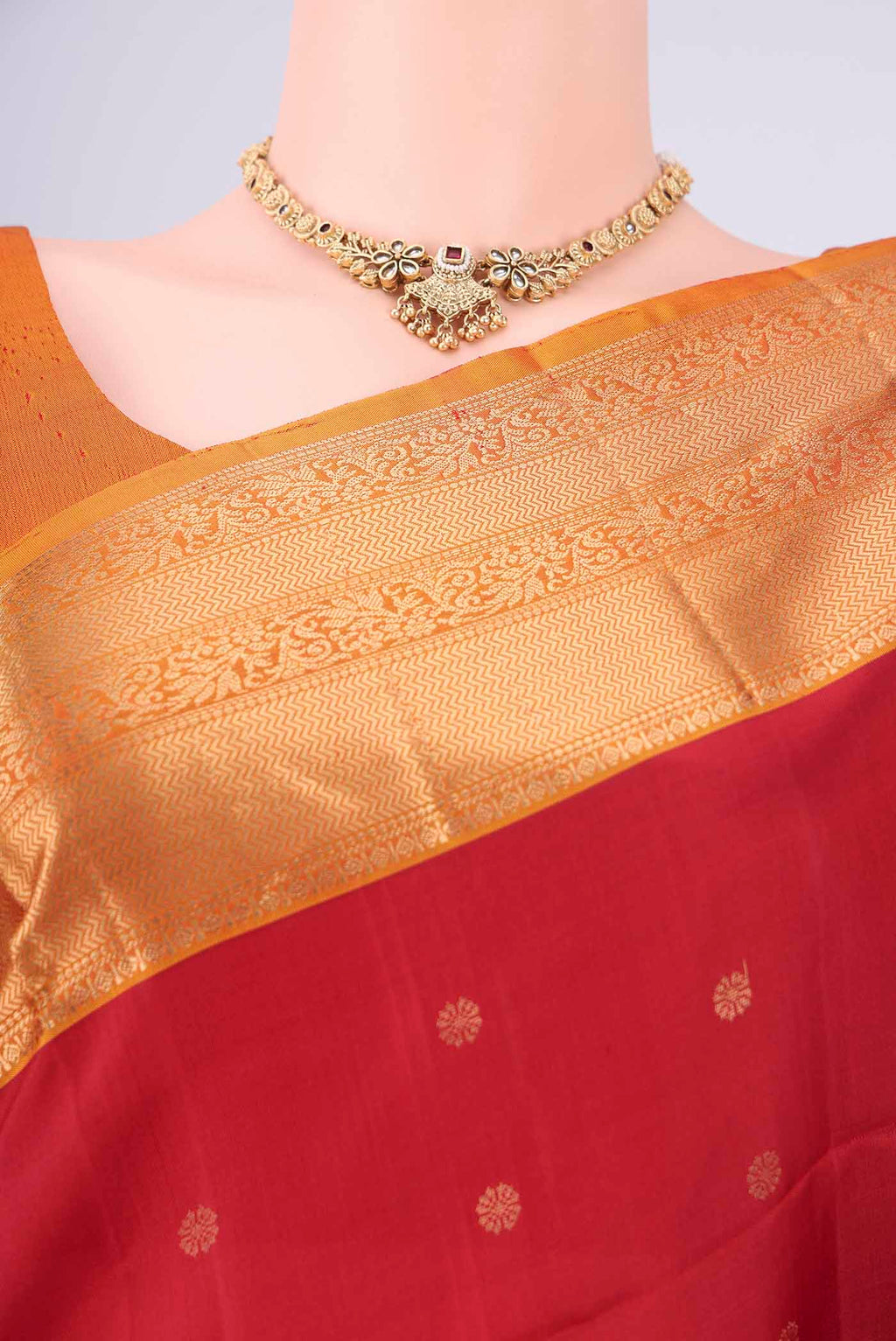 Border image of Maroon Soft Silk Saree with Zari Butta on the body and Zari Border. 