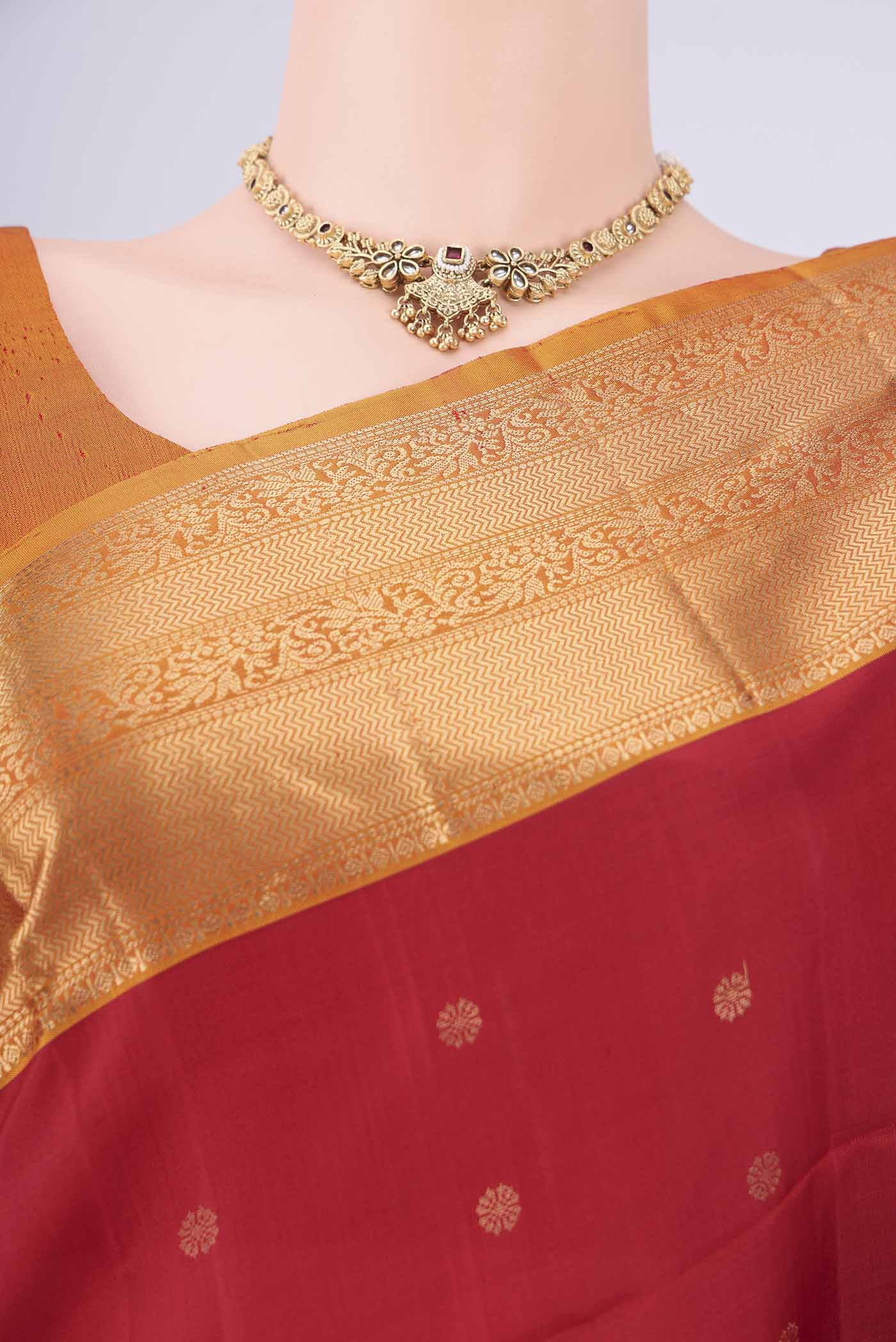 Border image of Maroon Soft Silk Saree with Zari Butta on the body and Zari Border. 
