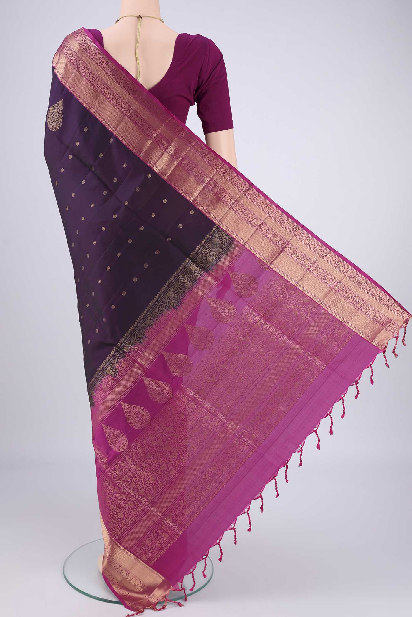 Flat view of Purple Soft Silk Saree with Zig Zag design on the body and Zari Border. 