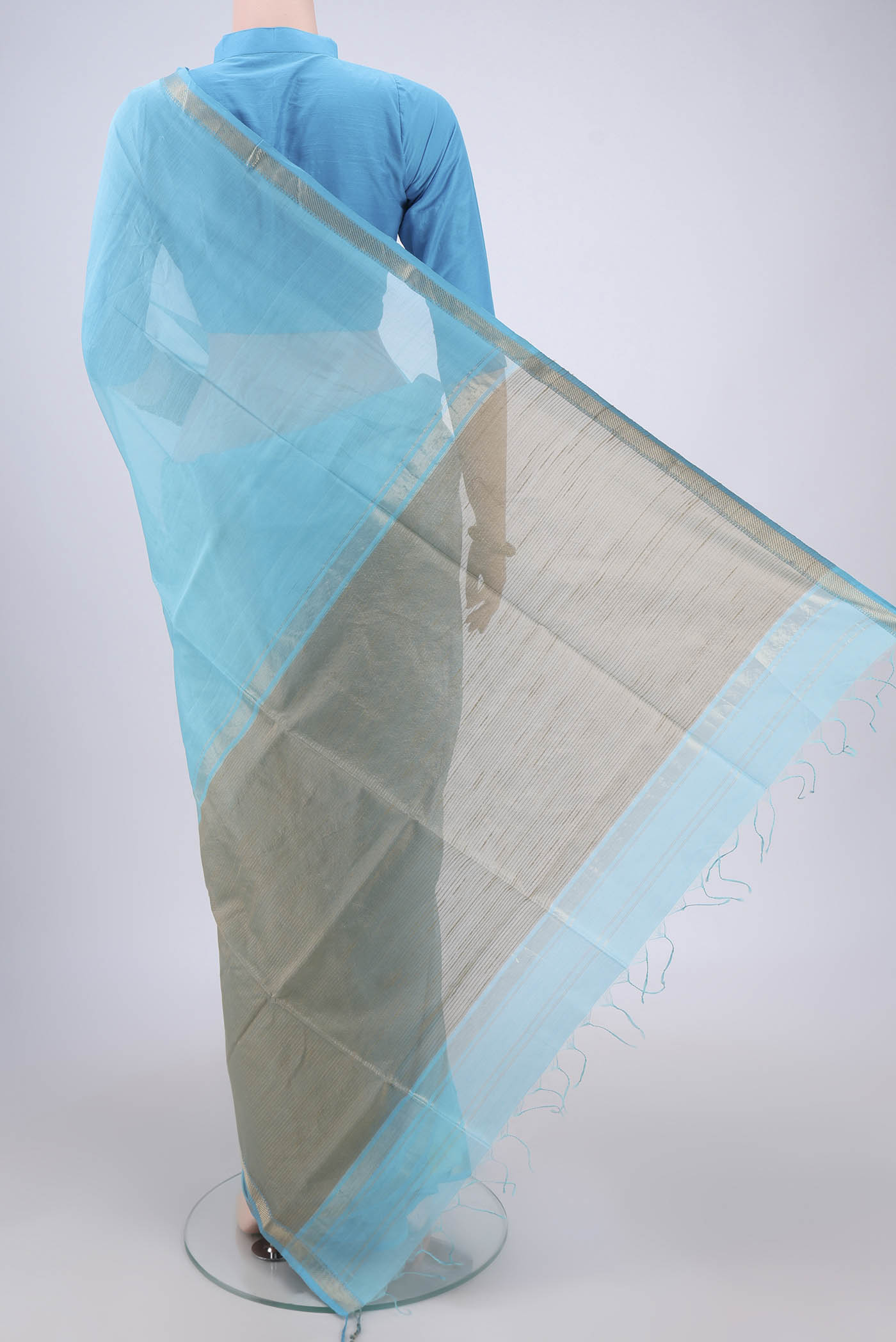 Flat view of Blue Maheshwari Silk Cotton Saree with Plain Body and Zari Border. 