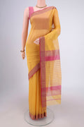 Mustard Maheshwari Silk Cotton Saree with Plain Body and Zari Border.  displayed on a mannequin