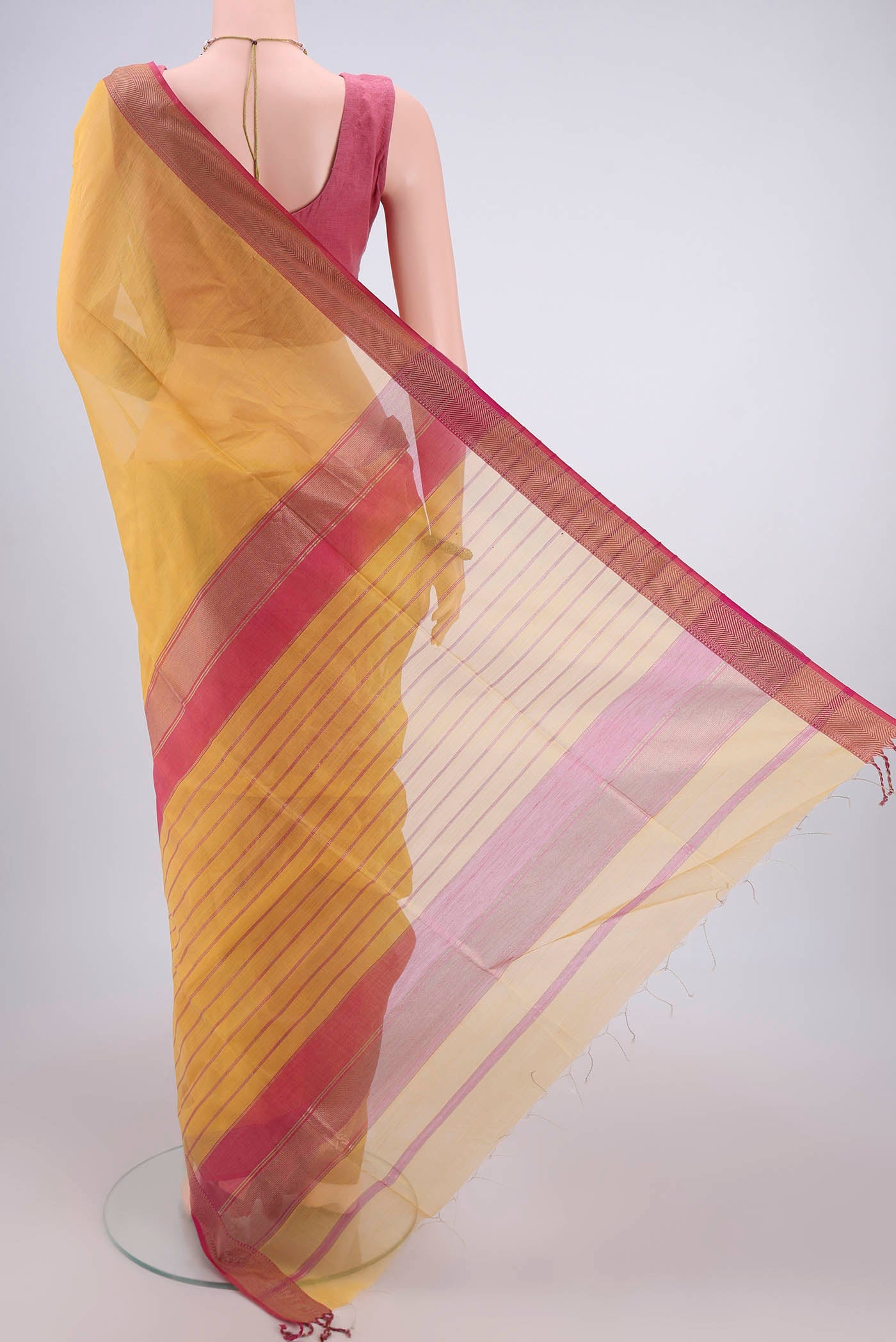 Flat view of Mustard Maheshwari Silk Cotton Saree with Plain Body and Zari Border. 