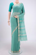 Sea Green Maheshwari Silk Cotton Saree with Checked design on the body and Zari Border.  displayed on a mannequin