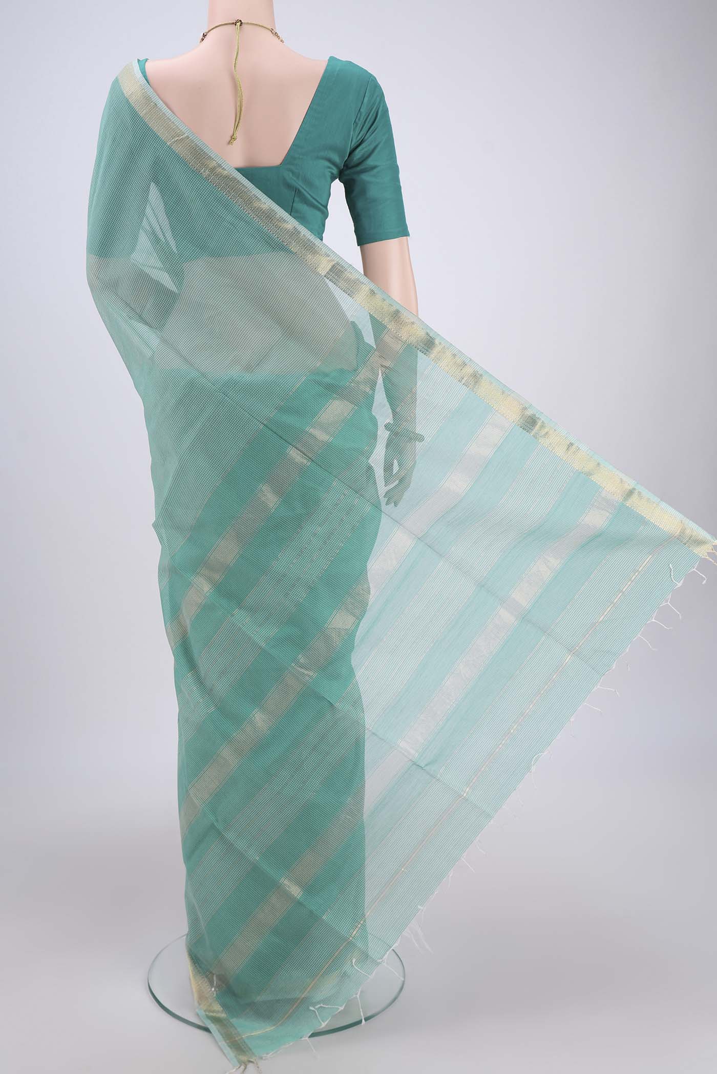 Flat view of Sea Green Maheshwari Silk Cotton Saree with Checked design on the body and Zari Border. 