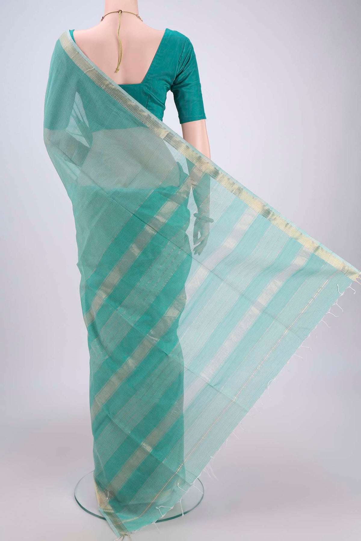 Flat view of Sea Green Maheshwari Silk Cotton Saree with Checked design on the body and Zari Border. 
