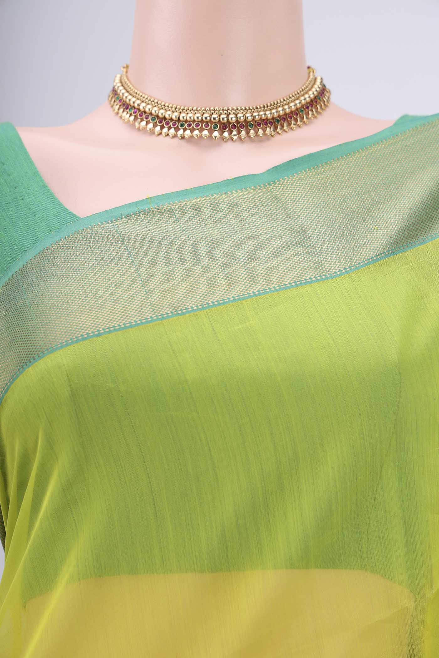 Border image of Acid Green Maheshwari Silk Cotton Saree with Plain Body and Zari Border. 