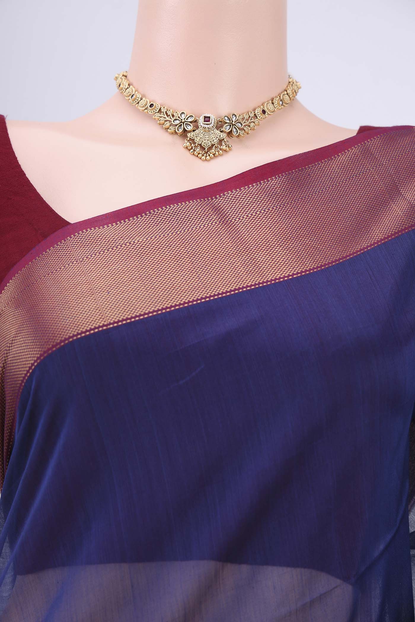 Border image of Purple Maheshwari Silk Cotton Saree with Stripes on the body and Zari Border. 