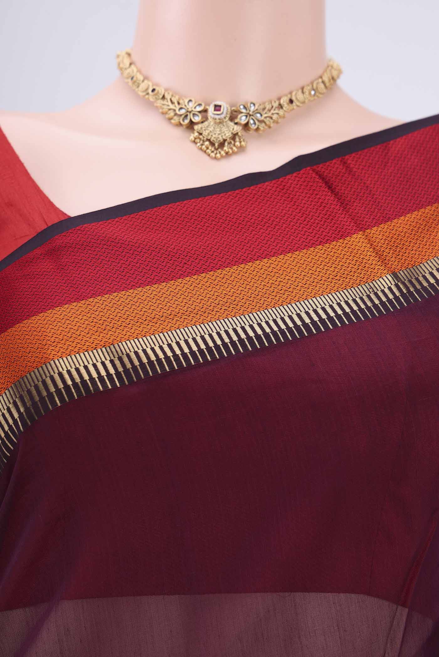 Border image of Burgundy Maheshwari Silk Cotton Saree with Plain Body and Zari Border. 