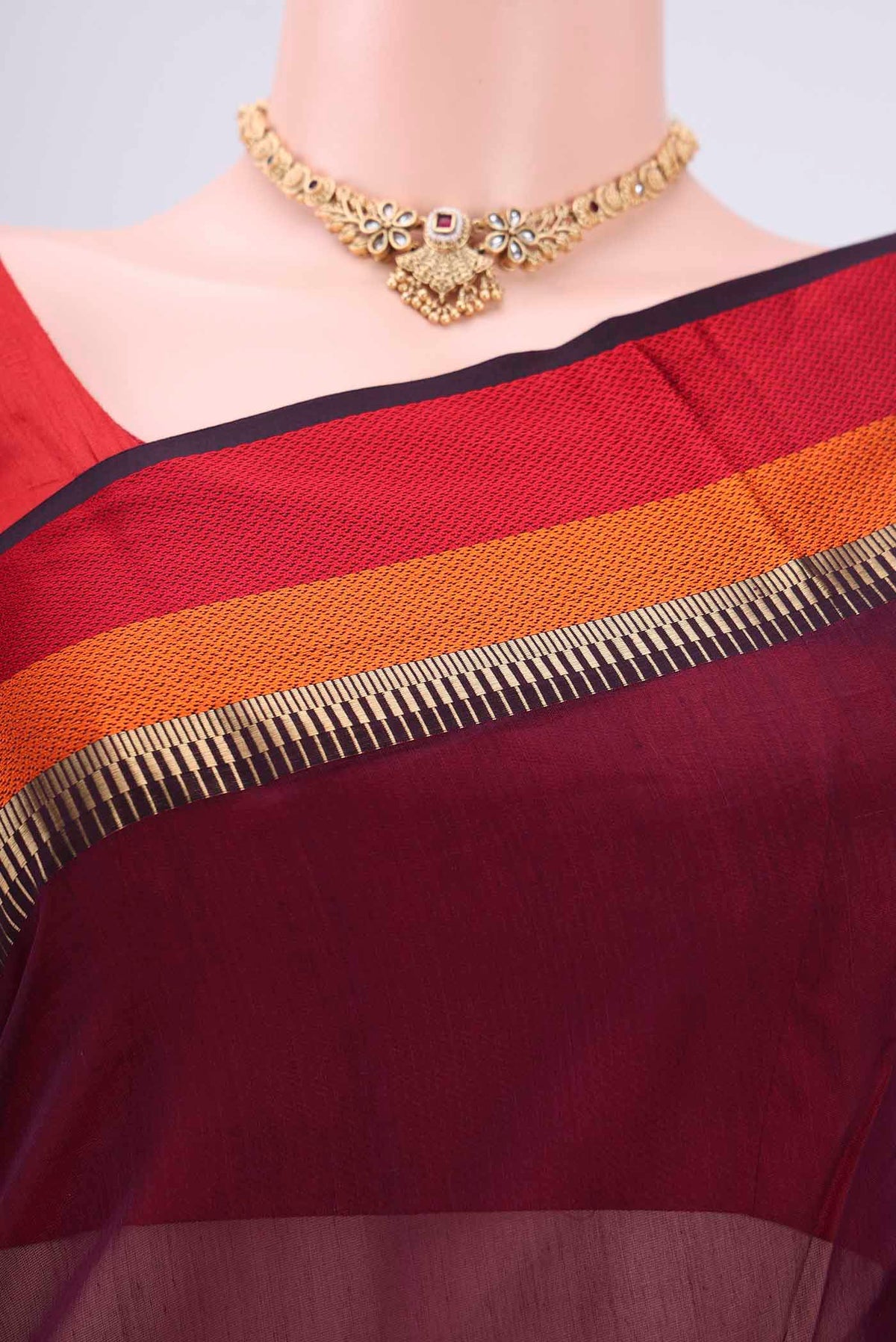 Border image of Burgundy Maheshwari Silk Cotton Saree with Plain Body and Zari Border. 