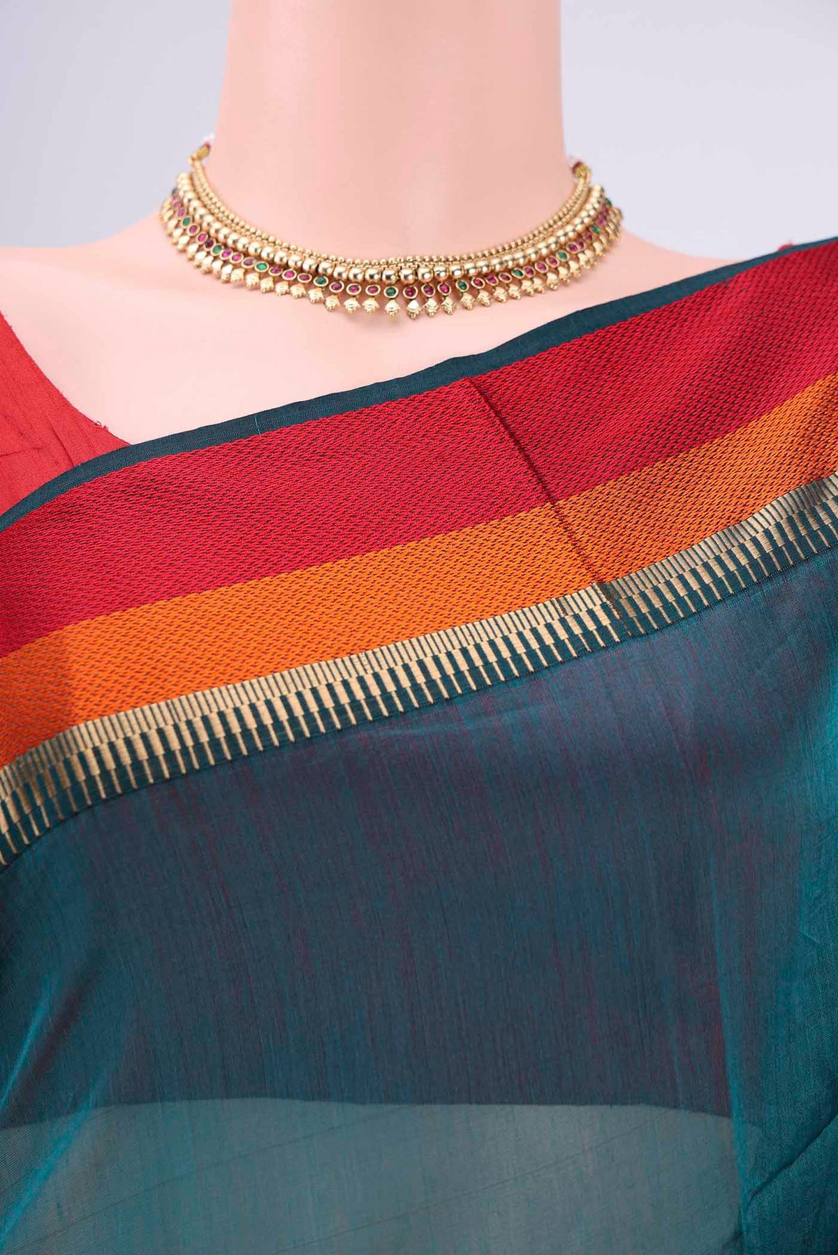 Border image of Teal Maheshwari Silk Cotton Saree with Plain Body and Zari And Thread Border. 