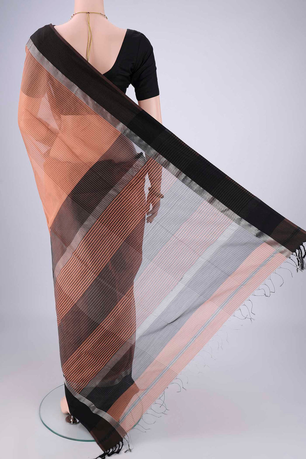 Flat view of Peach Maheshwari Silk Cotton Saree with Stripes on the body and Thread Border. 
