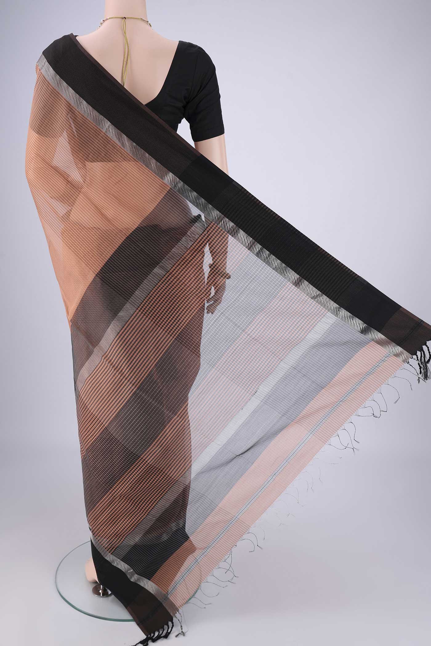 Flat view of Peach Maheshwari Silk Cotton Saree with Stripes on the body and Thread Border. 